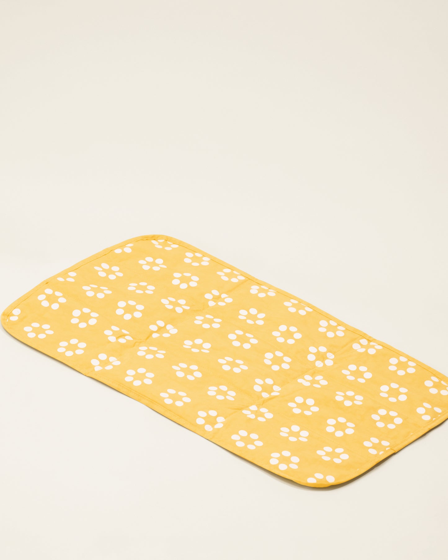 The changing pad of the Quick Change Kit Bag in Sunshine Dots print