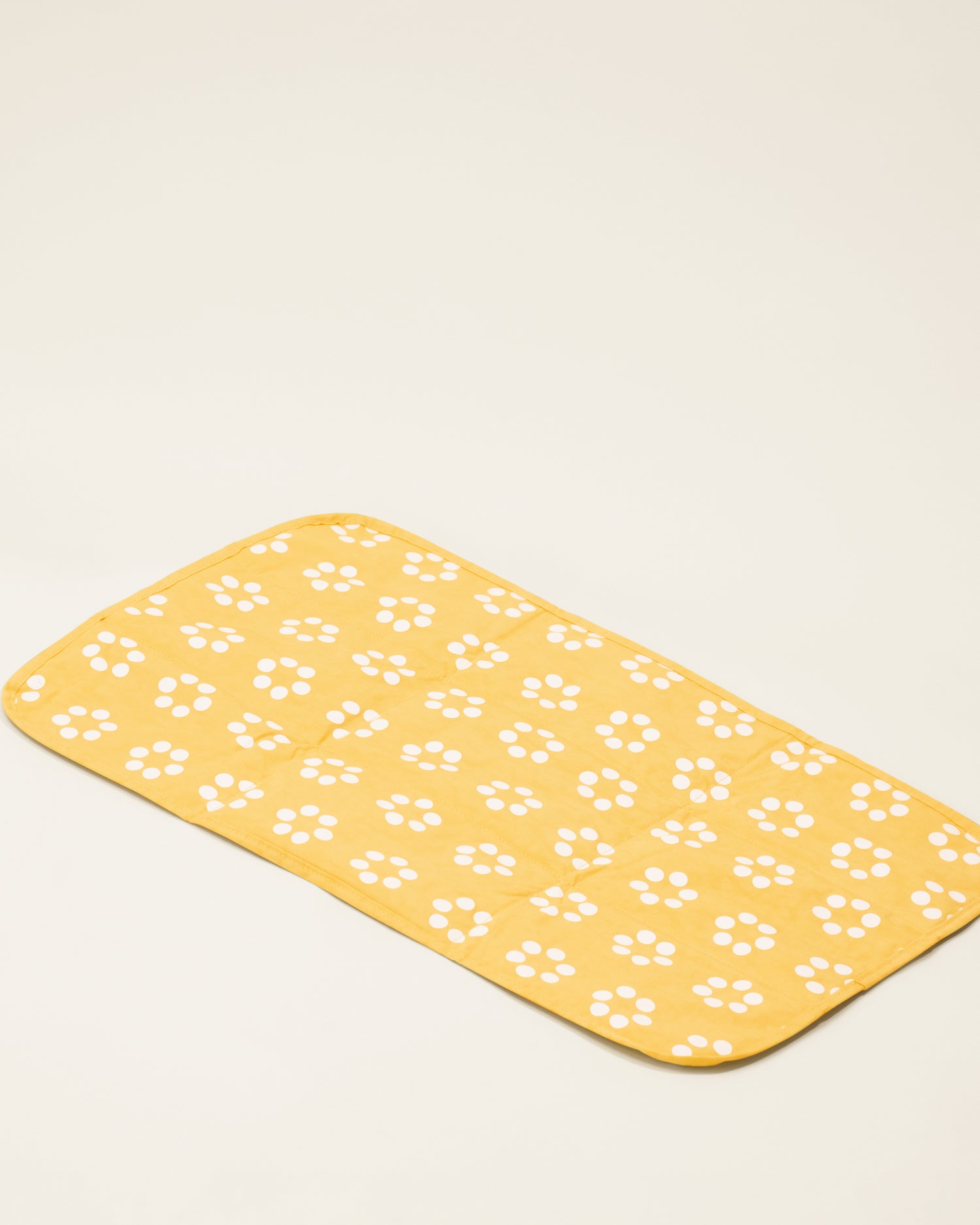The changing pad of the Quick Change Kit Bag in Sunshine Dots print