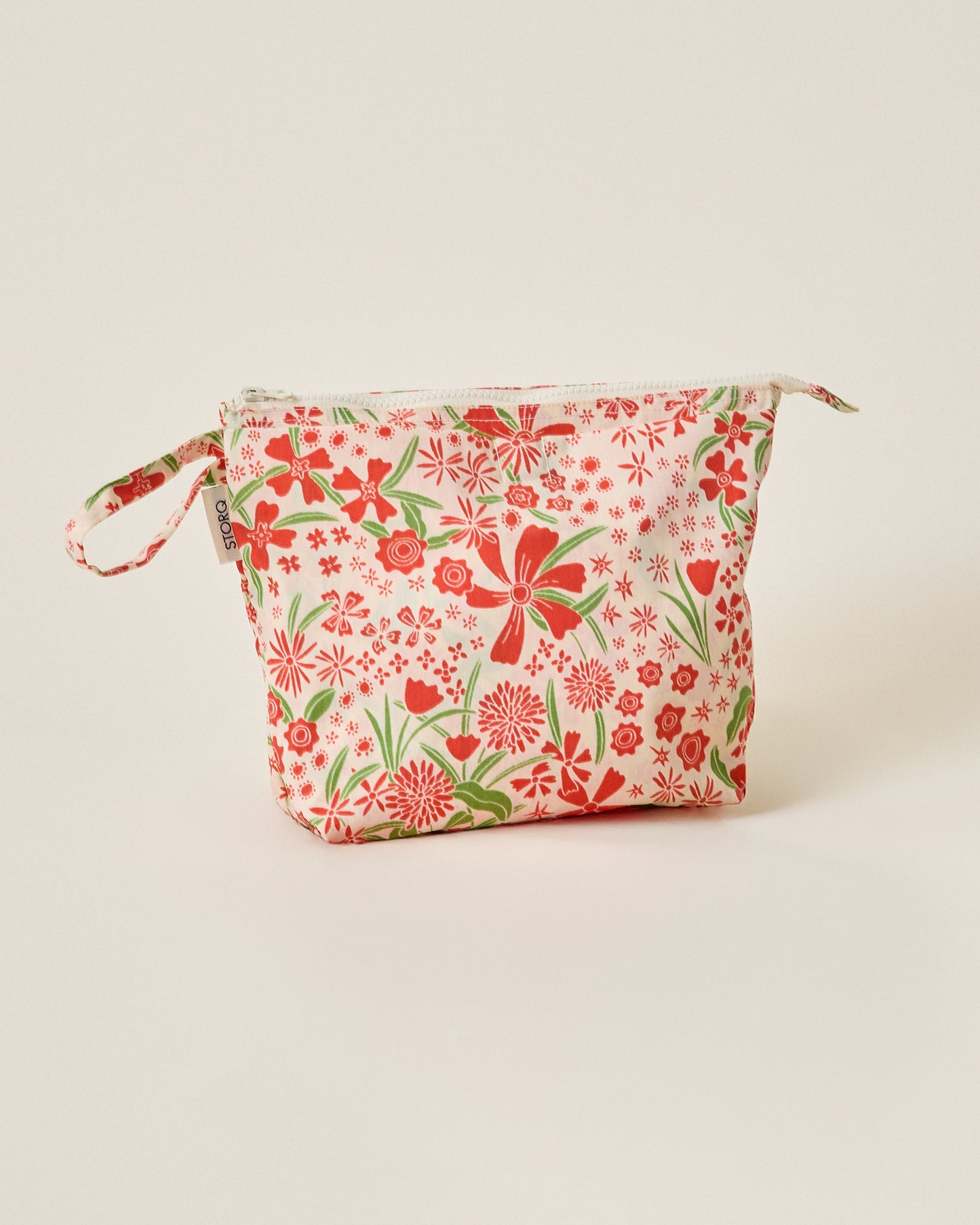 Quick Change Kit Bag in Superbloom on a beige background