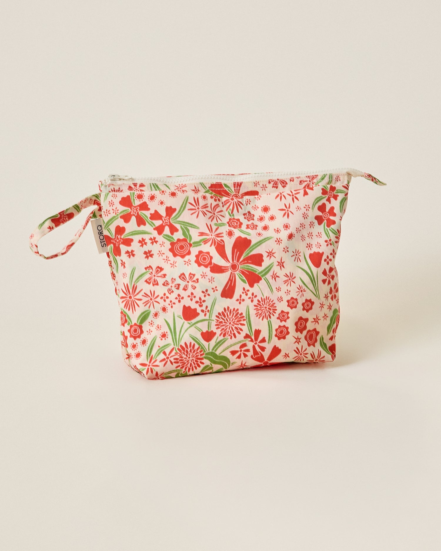 Quick Change Kit Bag in Superbloom on a beige background