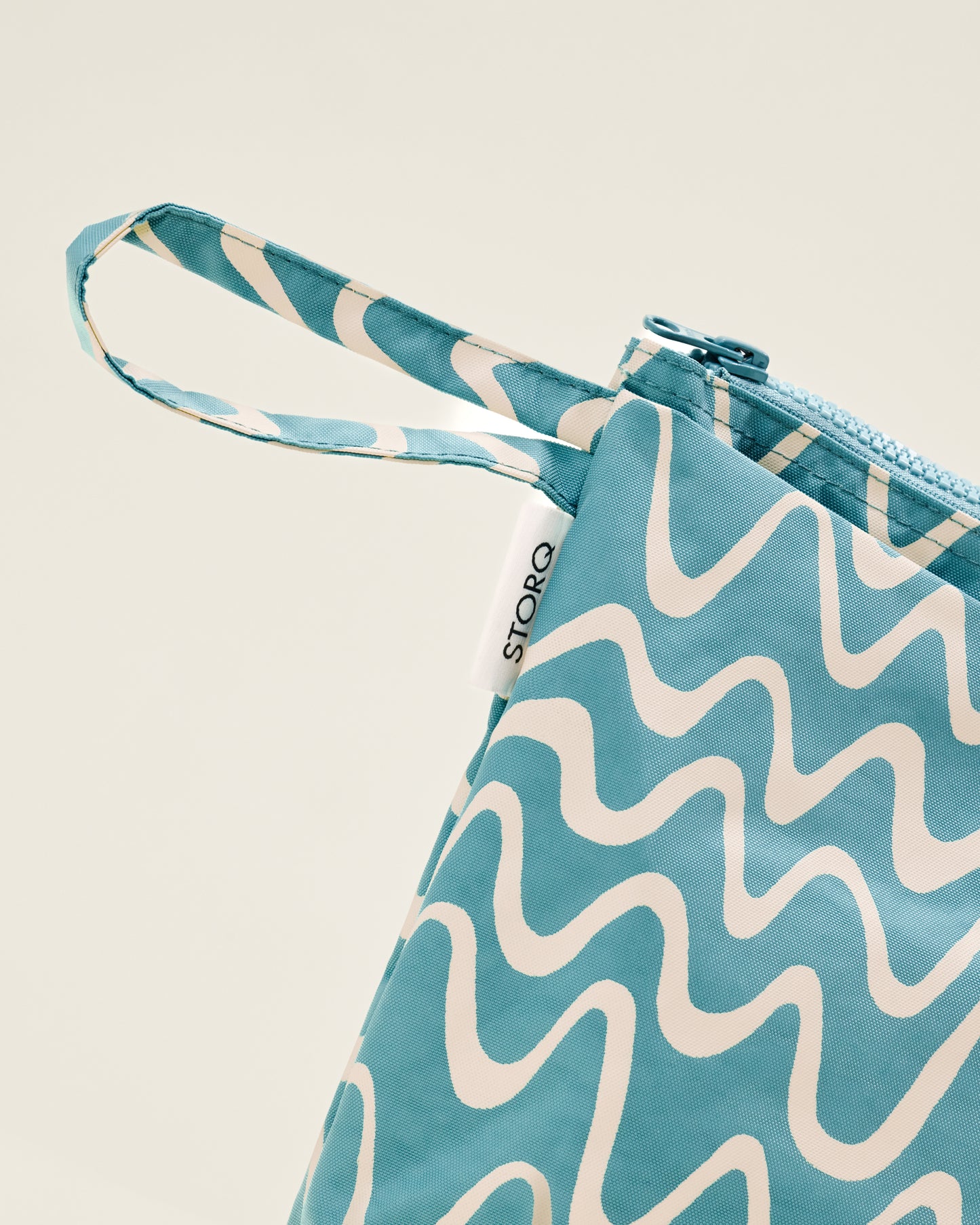 Close up of Quick Change Kit Bag in Blue Waves print