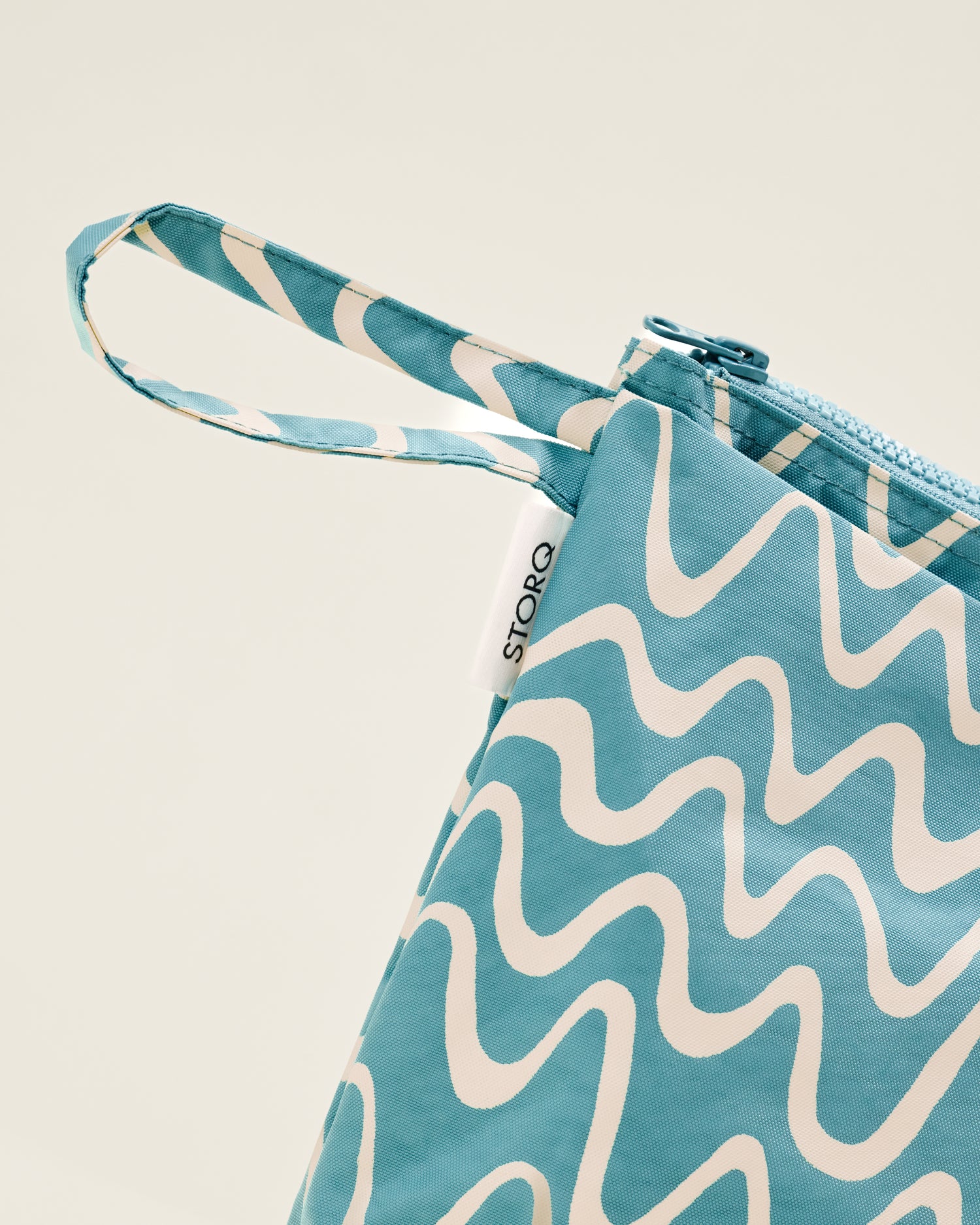 Close up of Quick Change Kit Bag in Blue Waves print