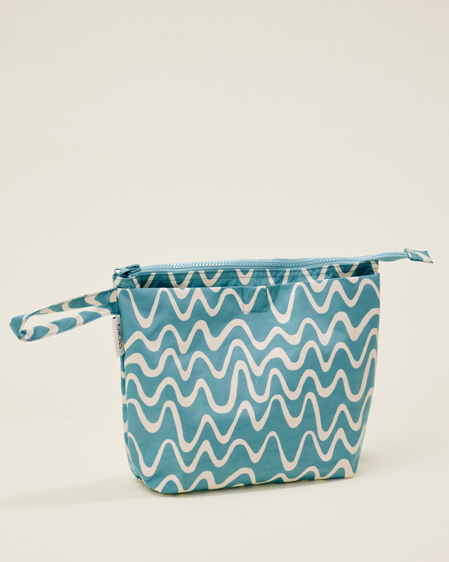 Quick Change Kit Bag in Blue Waves print, on a neutral background