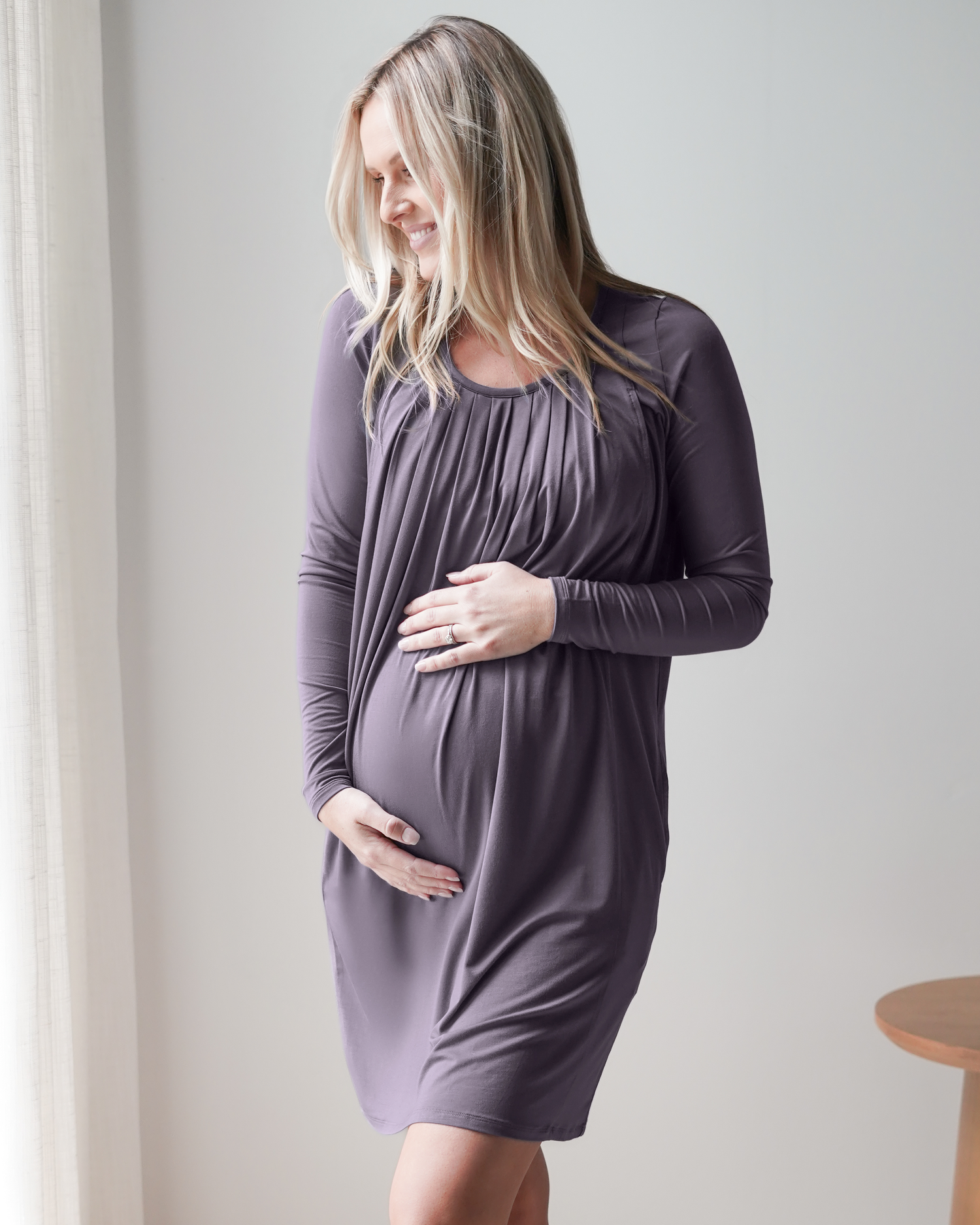 Pregnant model wearing the Quinn Bamboo Long Sleeve Maternity & Nursing Nightgown in Granite with hands on belly.@model_info:Maddy is 5'8" and wearing a Small.