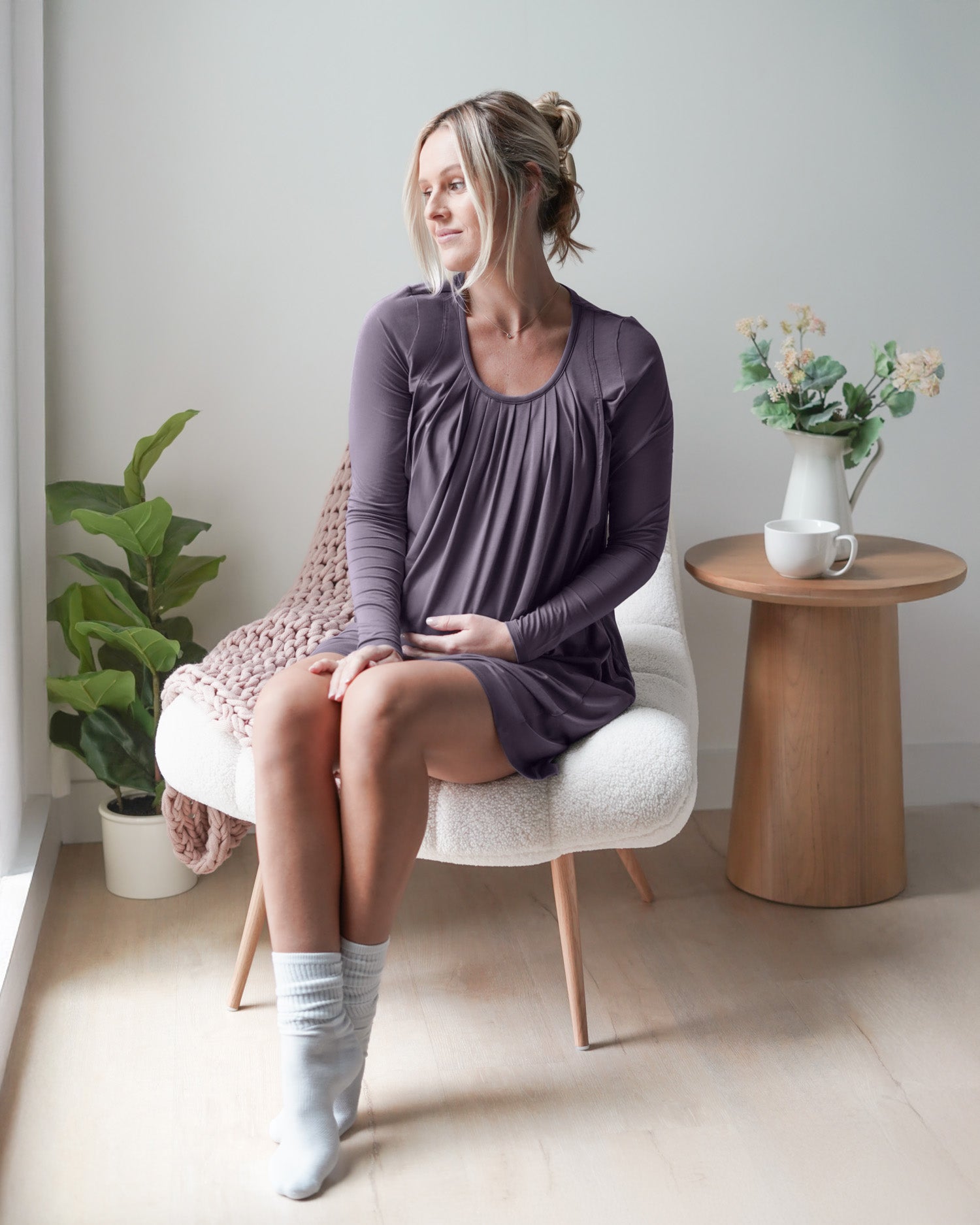 Model sitting in chair wearing the Quinn Bamboo Long Sleeve Maternity & Nursing Nightgown in Granite