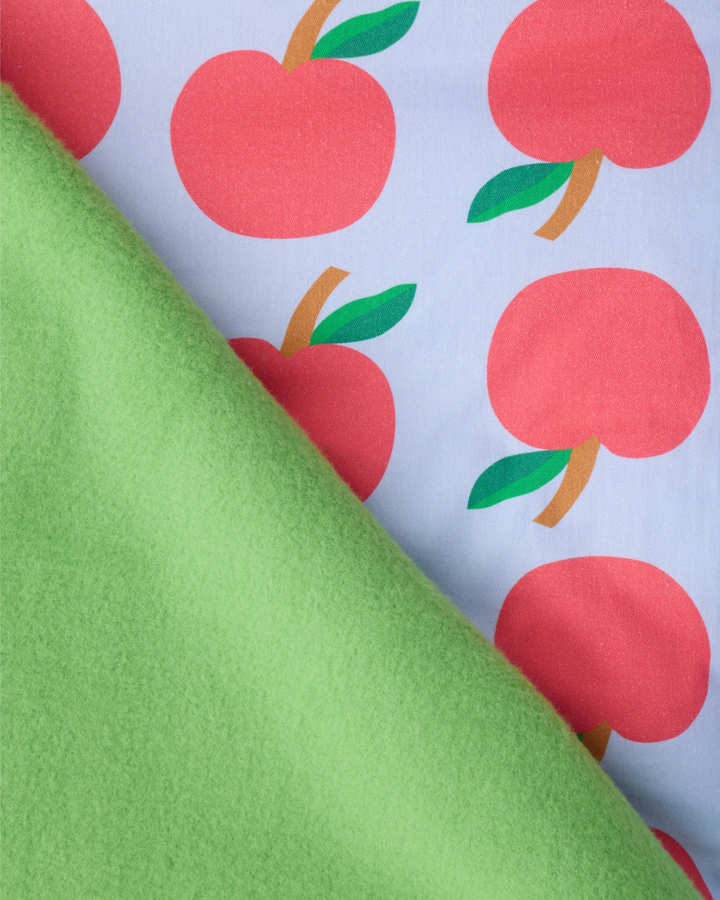 Close up of the padding and blanket of the Cool Kid Nap Mat in Blue Apple.