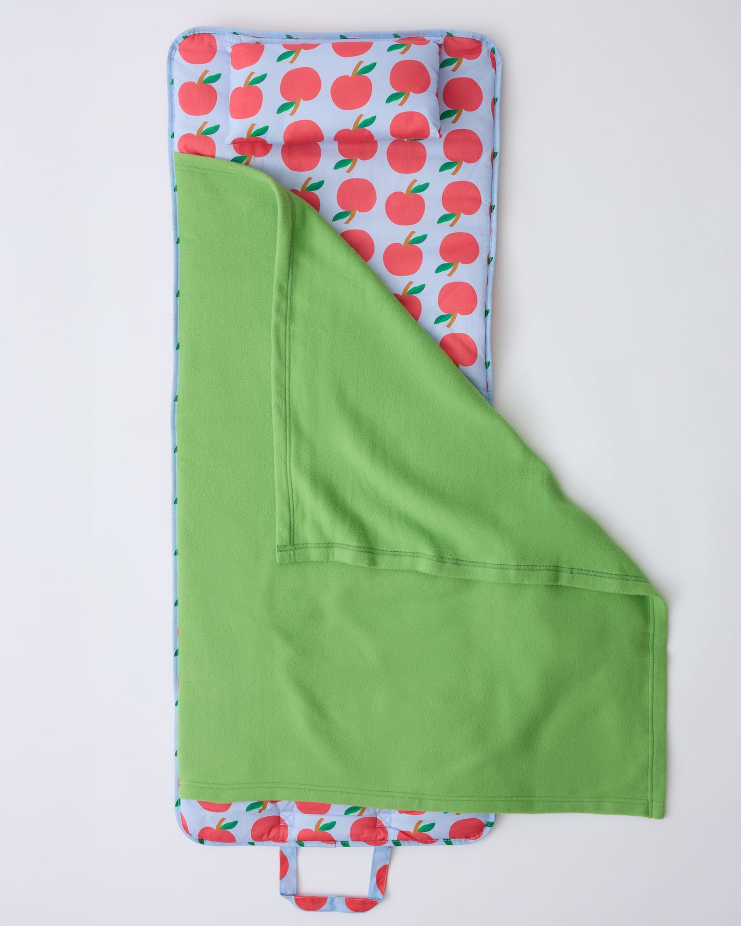 The open flat lay of Cool Kid Nap Mat in Blue Apple on a beige background.