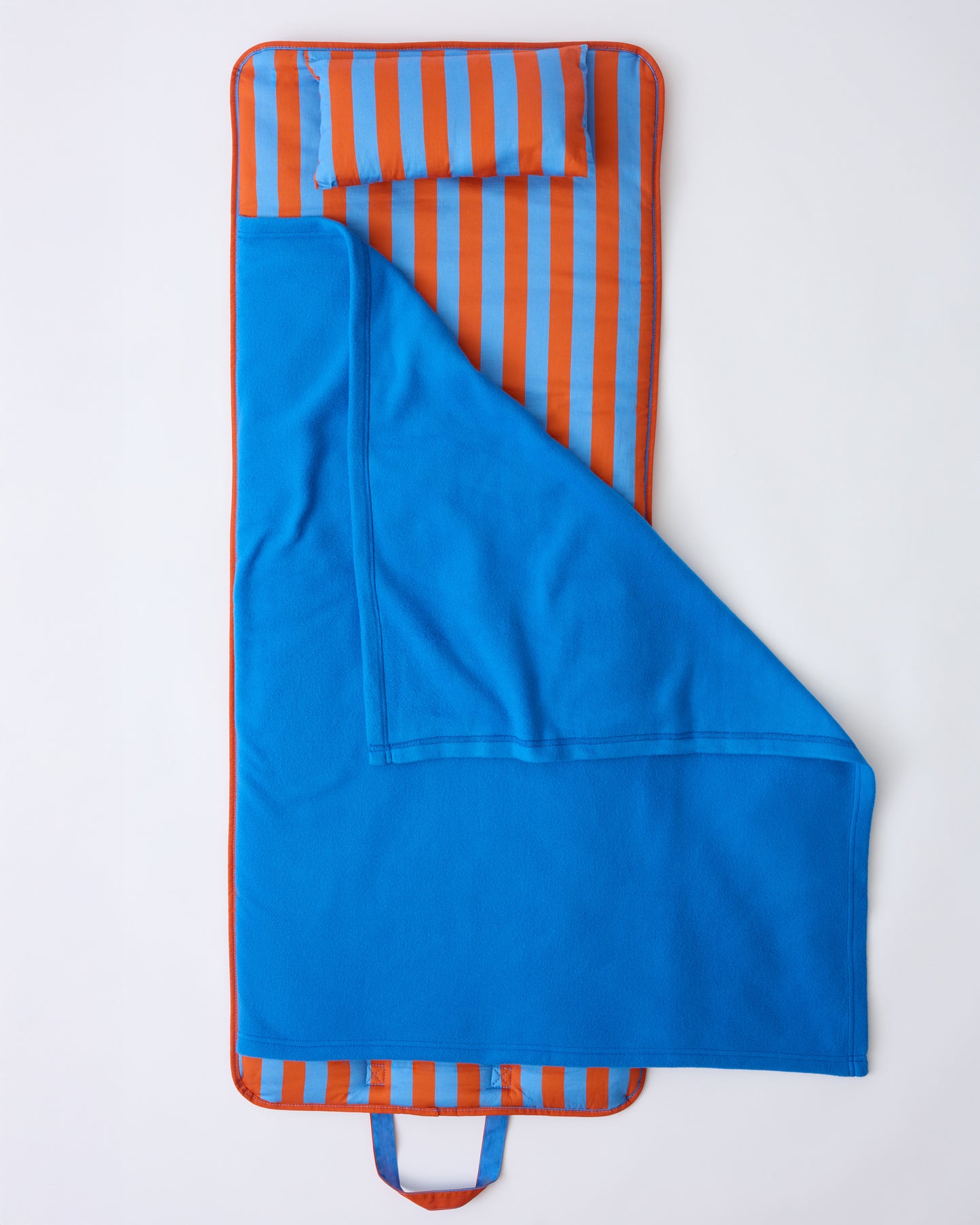 The open flat lay of Cool Kid Nap Mat in Blue & Rust Stripe on a beige background.