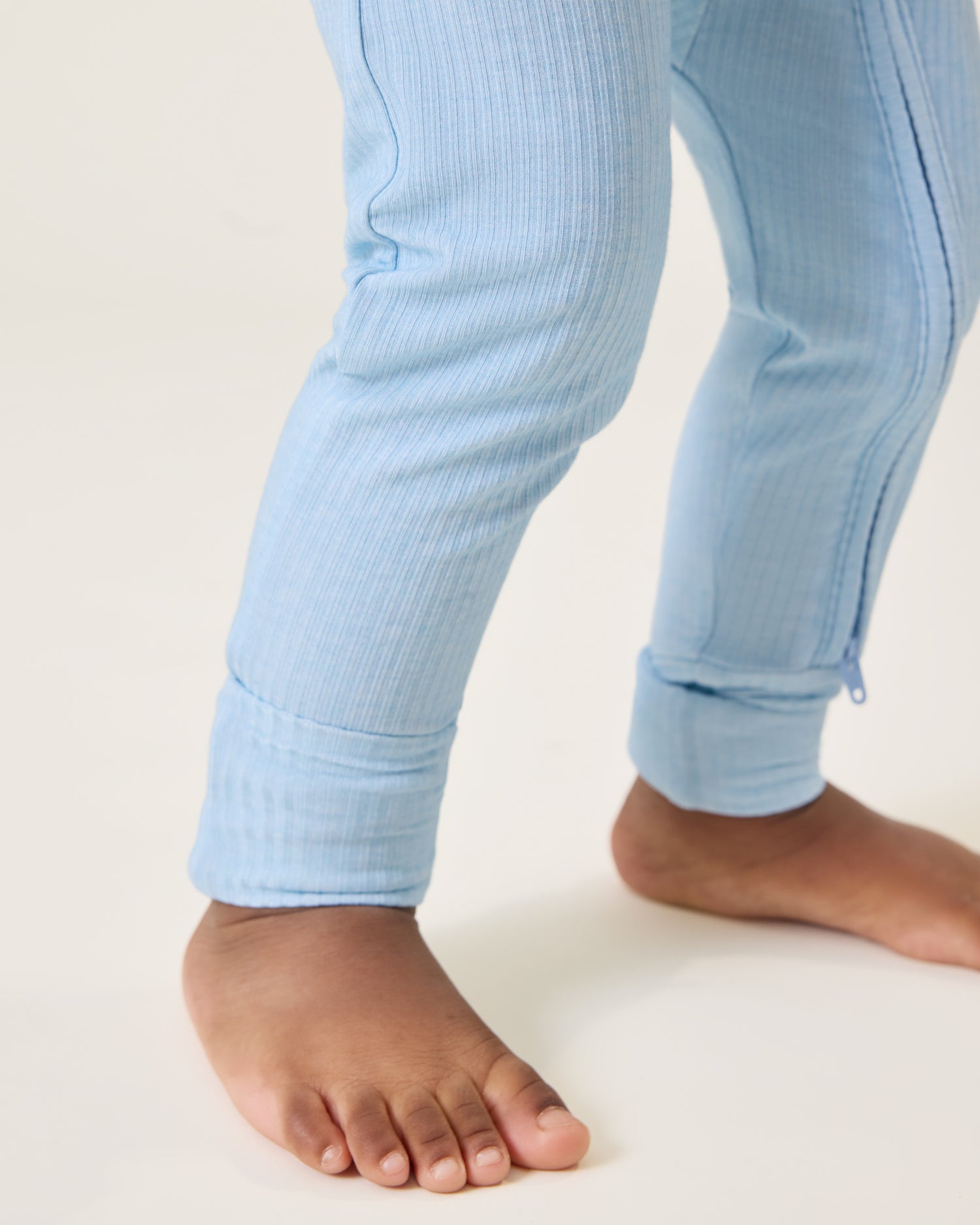 Close up of Baby wearing the Ribbed Bamboo Baby Pajama in Blue Heather