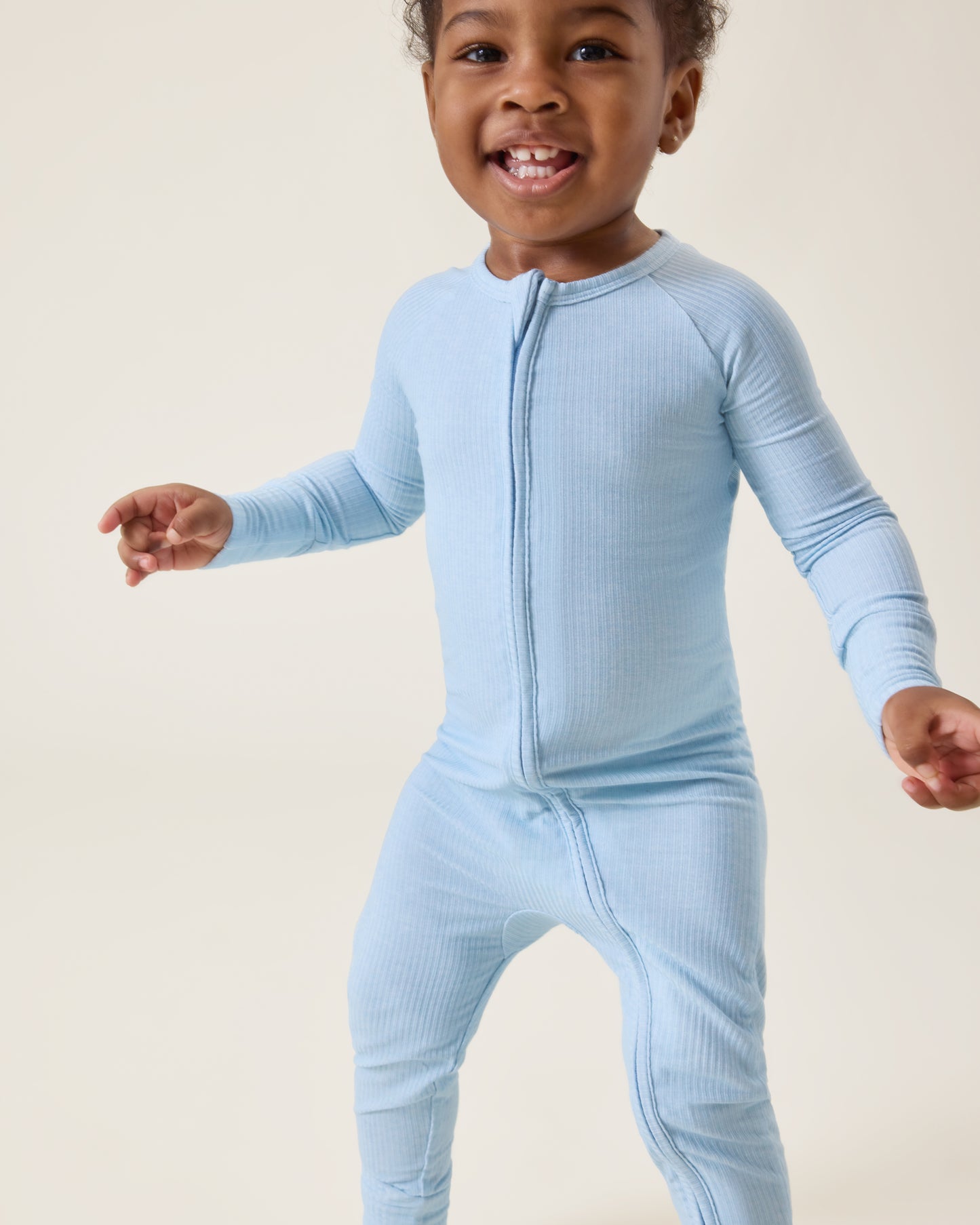 Baby wearing the Ribbed Bamboo Baby Pajama in Blue Heather@model_info:Harper is wearing 18-24 months.