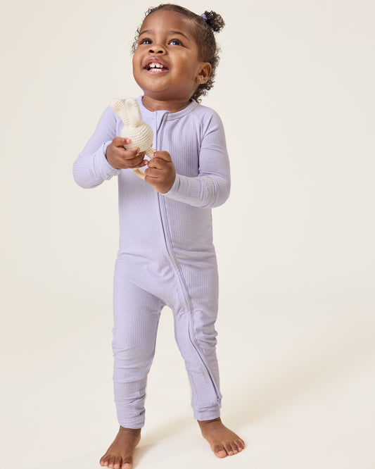 Baby wearing the Ribbed Bamboo Baby Pajama in Lilac Heather@model_info:Harper is wearing 18-24 months.
