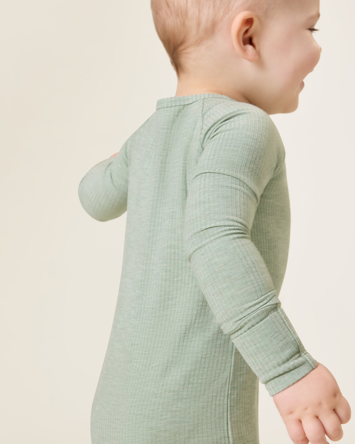 Baby wearing the Ribbed Bamboo Baby Pajama in Sage Heather
