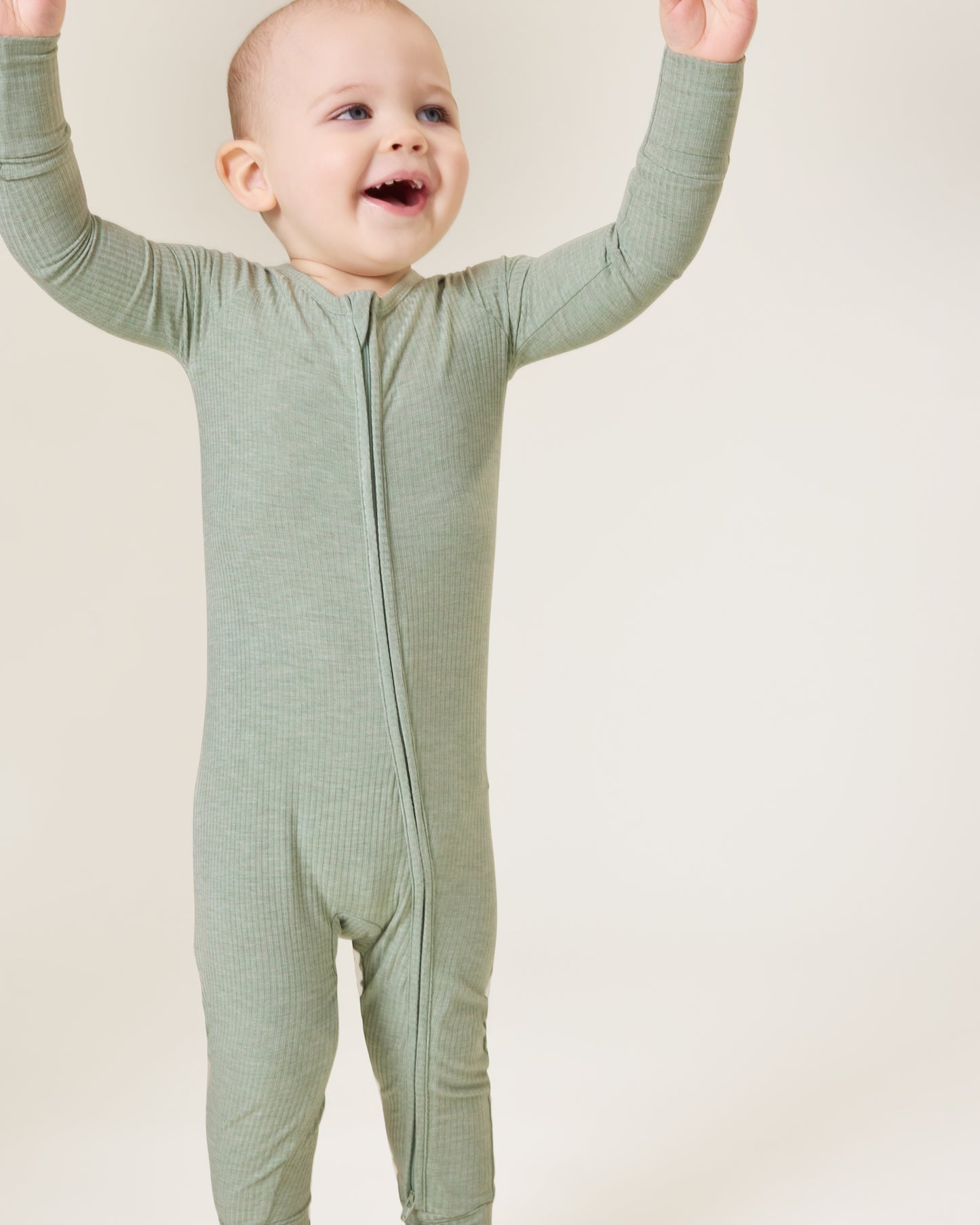 Baby wearing the Ribbed Bamboo Baby Pajama in Sage Heather@model_info:Clark is wearing 18-24 months.