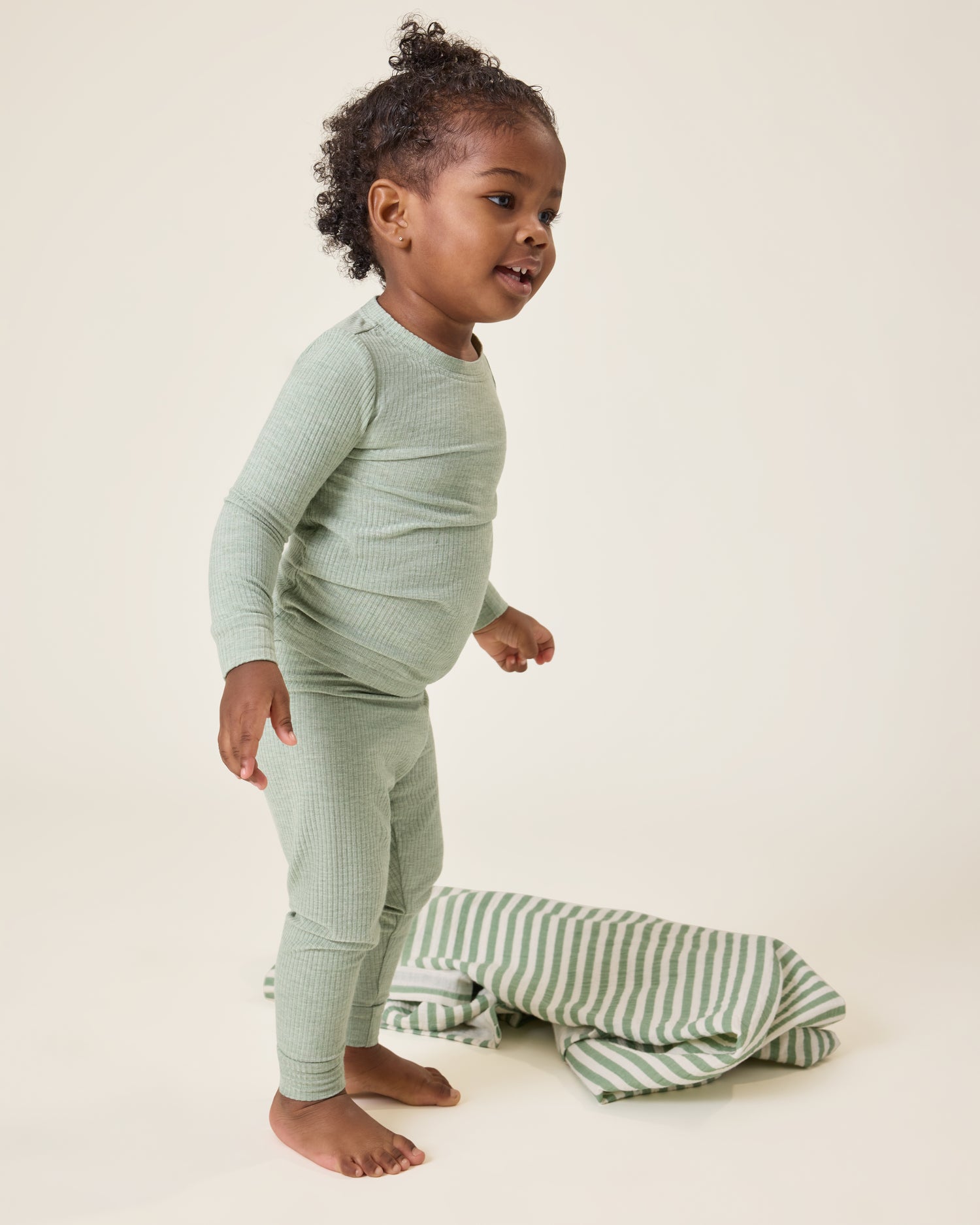Baby wearing the Ribbed Bamboo Baby Two-Piece Pajama Set in Sage Heather@model_info:Harper is wearing 18-24 months.
