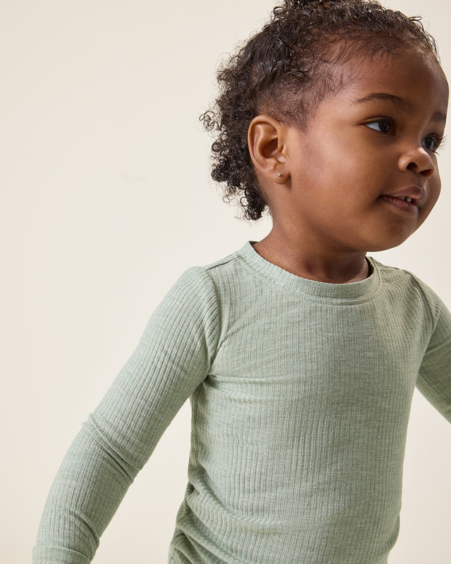 Baby wearing the Ribbed Bamboo Baby Two-Piece Pajama Set in Sage Heather