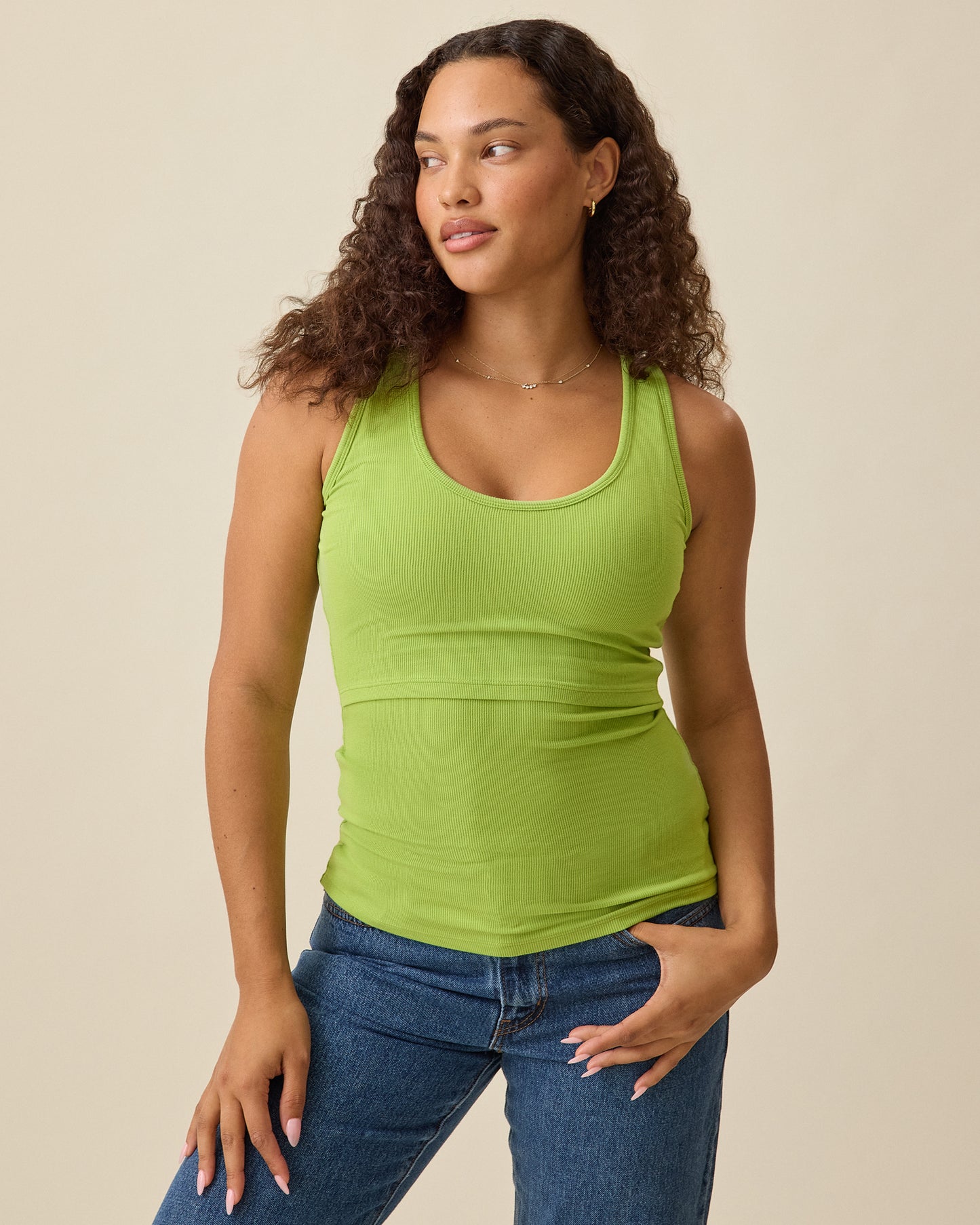 Model wearing Ribbed Bamboo Scoop Neck Nursing Tank in Avocado on a beige background @model_info:Mei is wearing a Small.