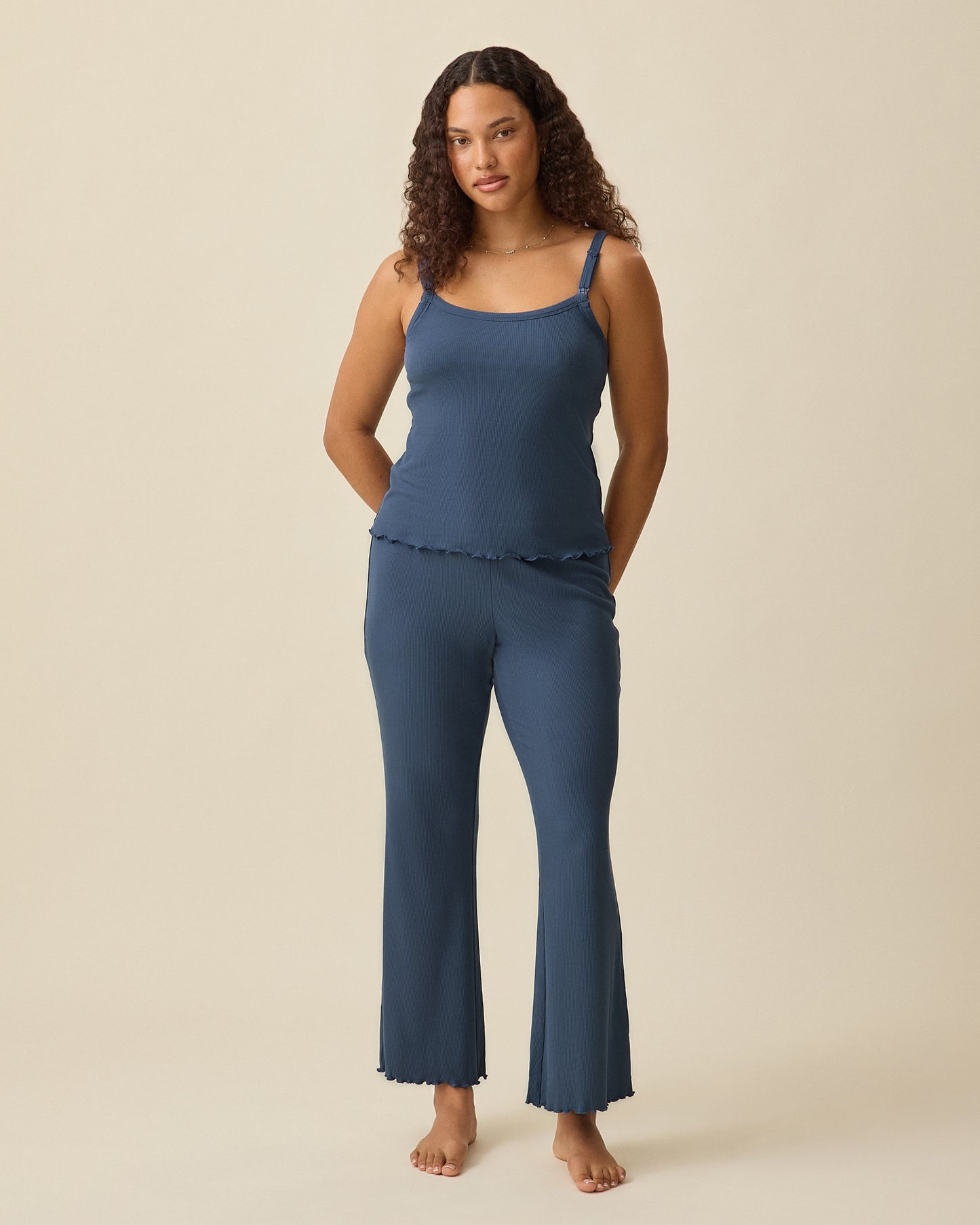 Model wearing Ribbed Modal Nursing Cami and Ribbed Modal Lounge Pant in Light Navy on a beige background.