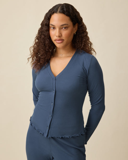 Model is wearing Ribbed Modal Separates Set in Light Navy on a beige background. Includes matching Cami, Cardigan and Lounge pant.@model_info:Mei is wearing a Small.