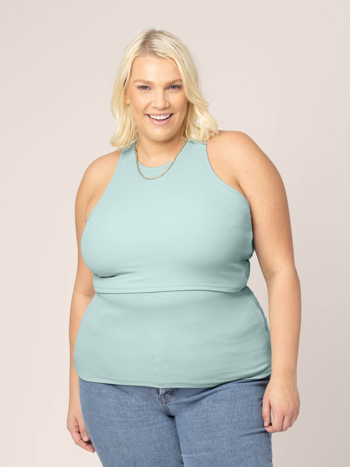 Front view of model wearing the Ribbed Bamboo Racerback Nursing Tank in Dusty Blue Green @model_info:Lauren is wearing a 1X.