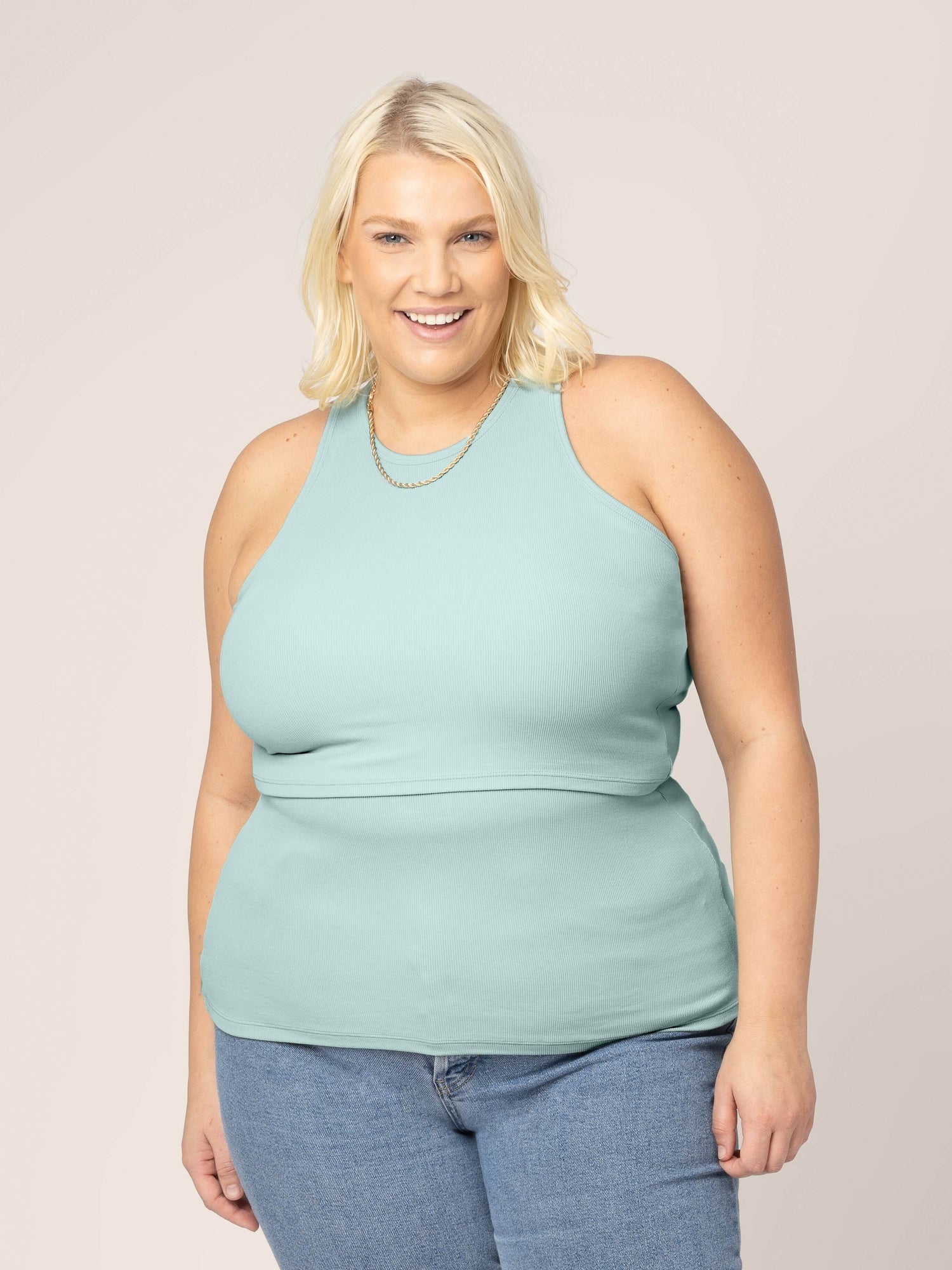 Front view of model wearing the Ribbed Bamboo Racerback Nursing Tank in Dusty Blue Green @model_info:Lauren is wearing a 1X.