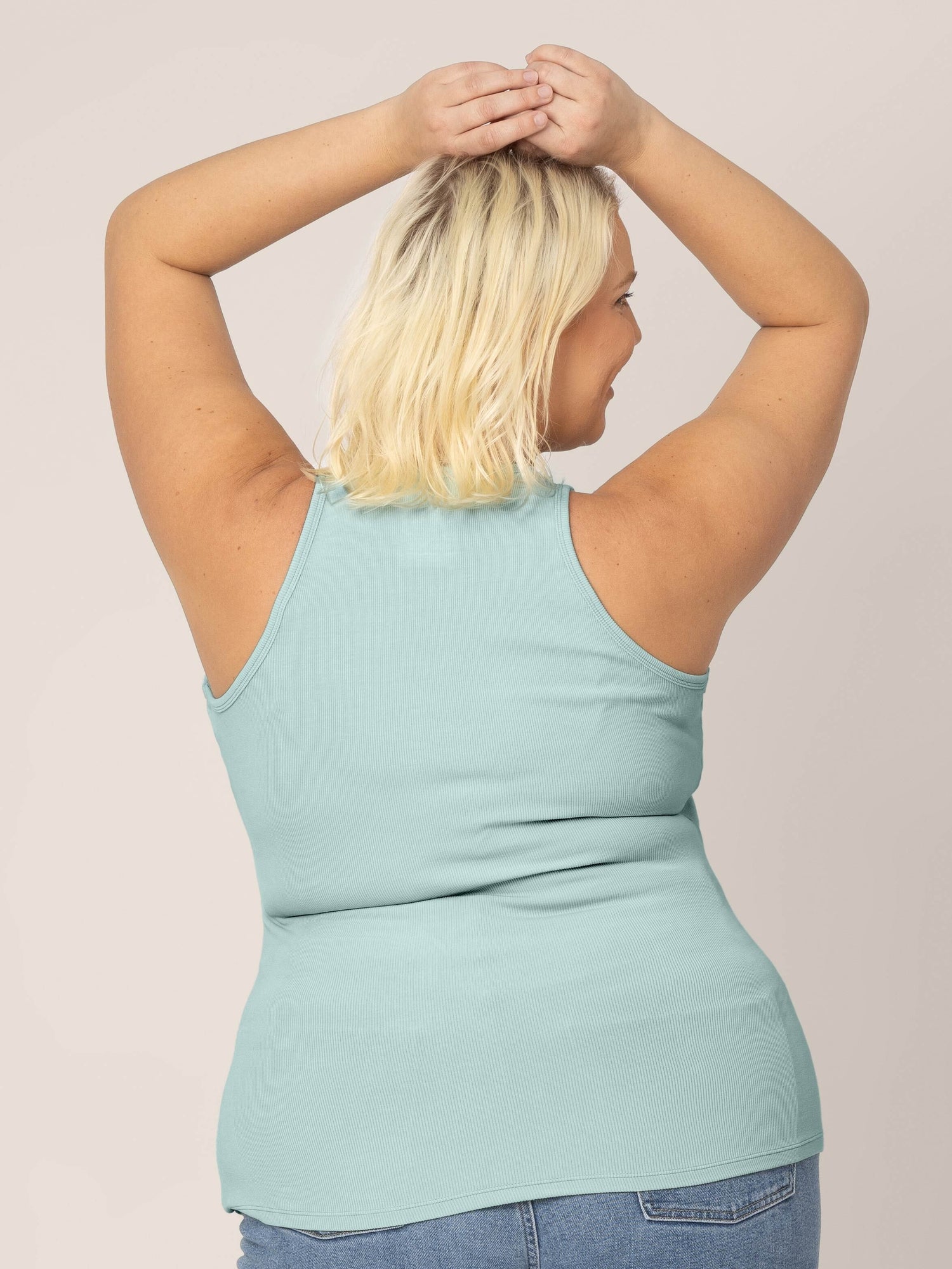 Back view of model in the Ribbed Bamboo Racerback Nursing Tank in Dusty Blue Green