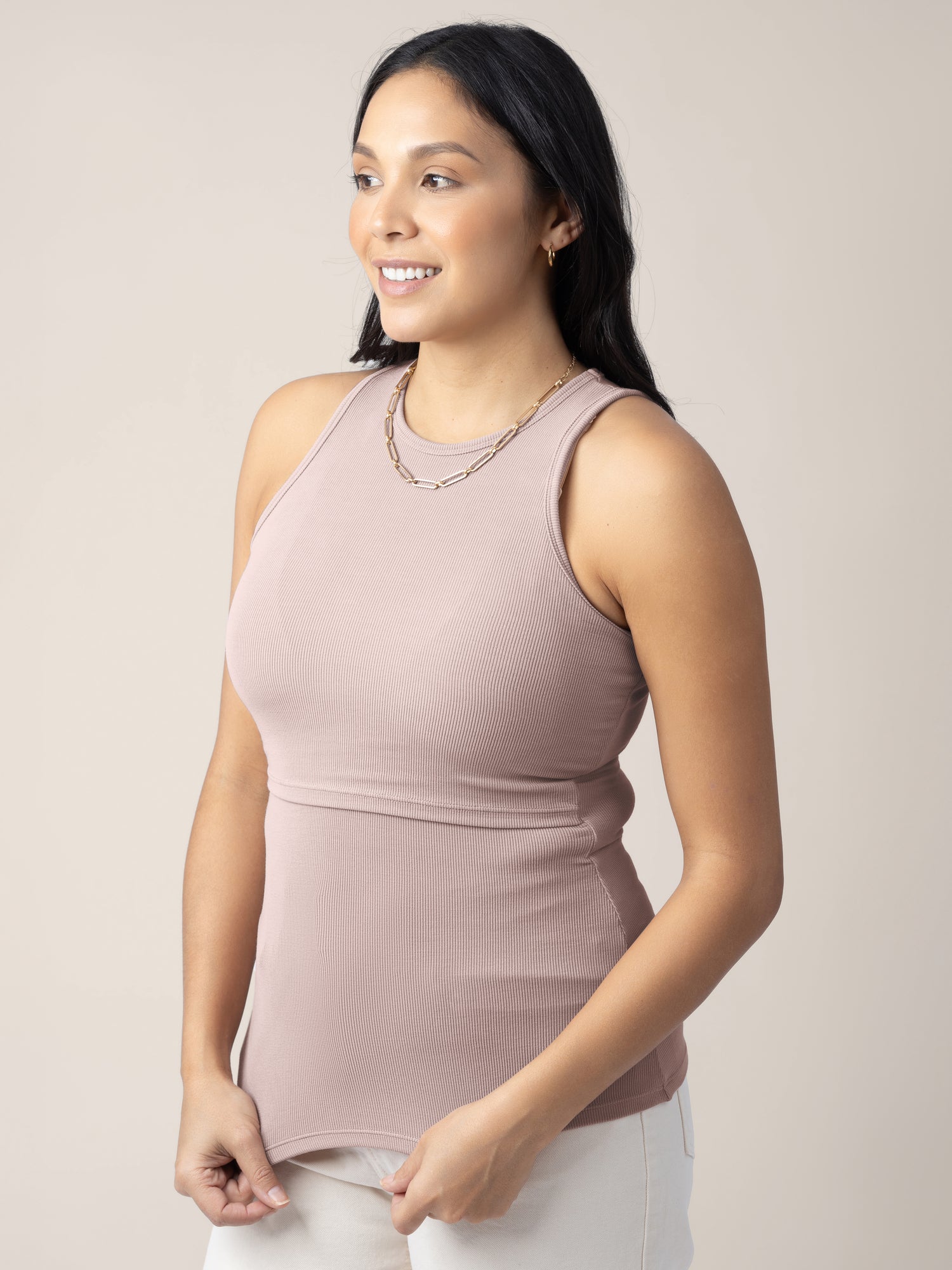 3/4 angle view of model wearing the Ribbed Bamboo Racerback Nursing Tank in lilac stone