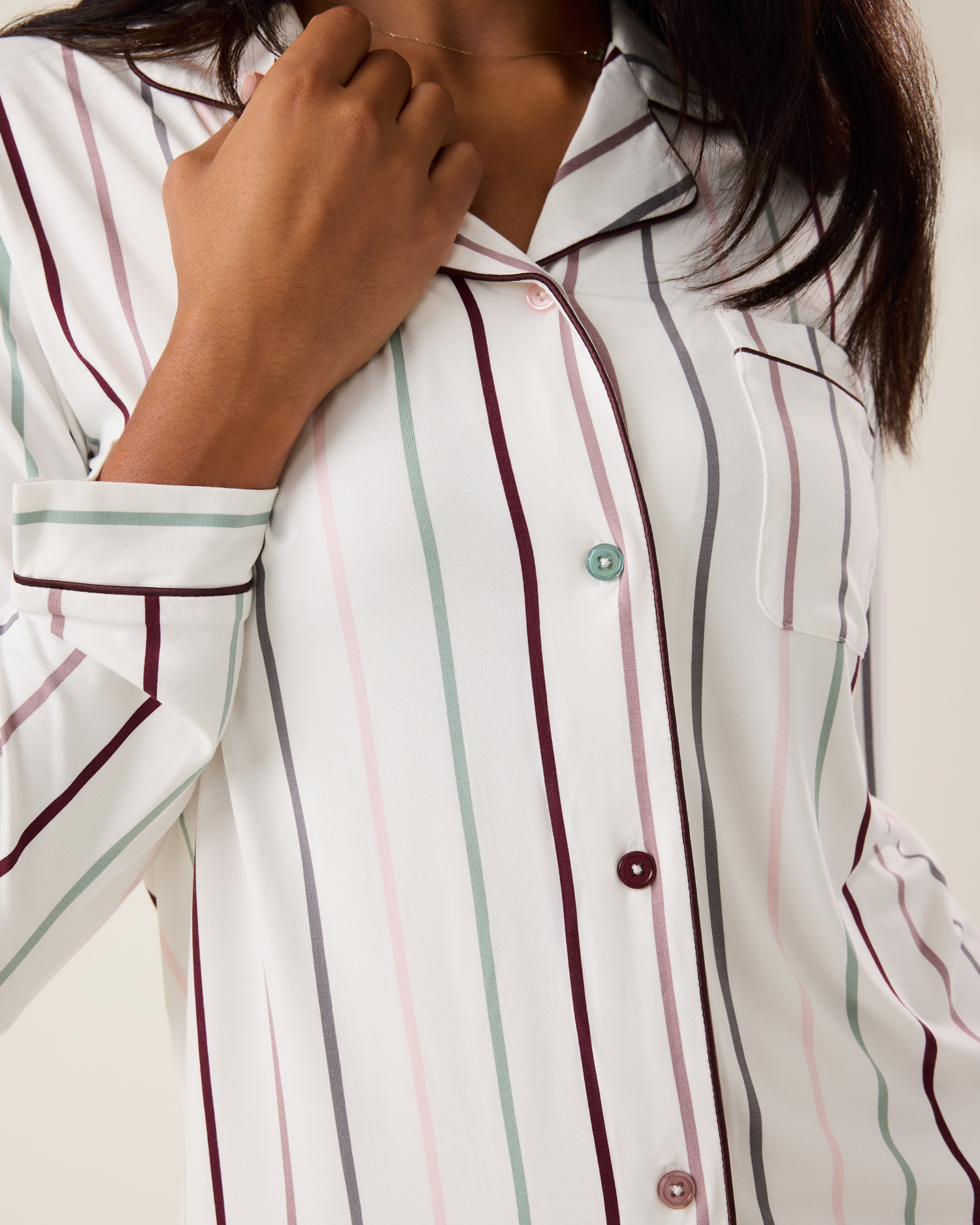 Woman wearing the Clea Bamboo Long Sleeve Pajama Set in Classic Stripe, with focus on buttons and collar