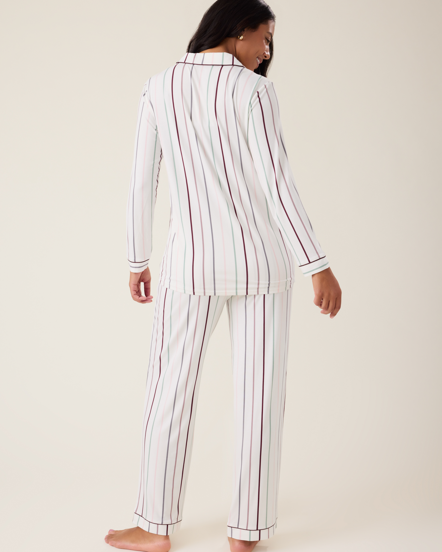 Woman wearing the Clea Bamboo Long Sleeve Pajama Set in Classic Stripe