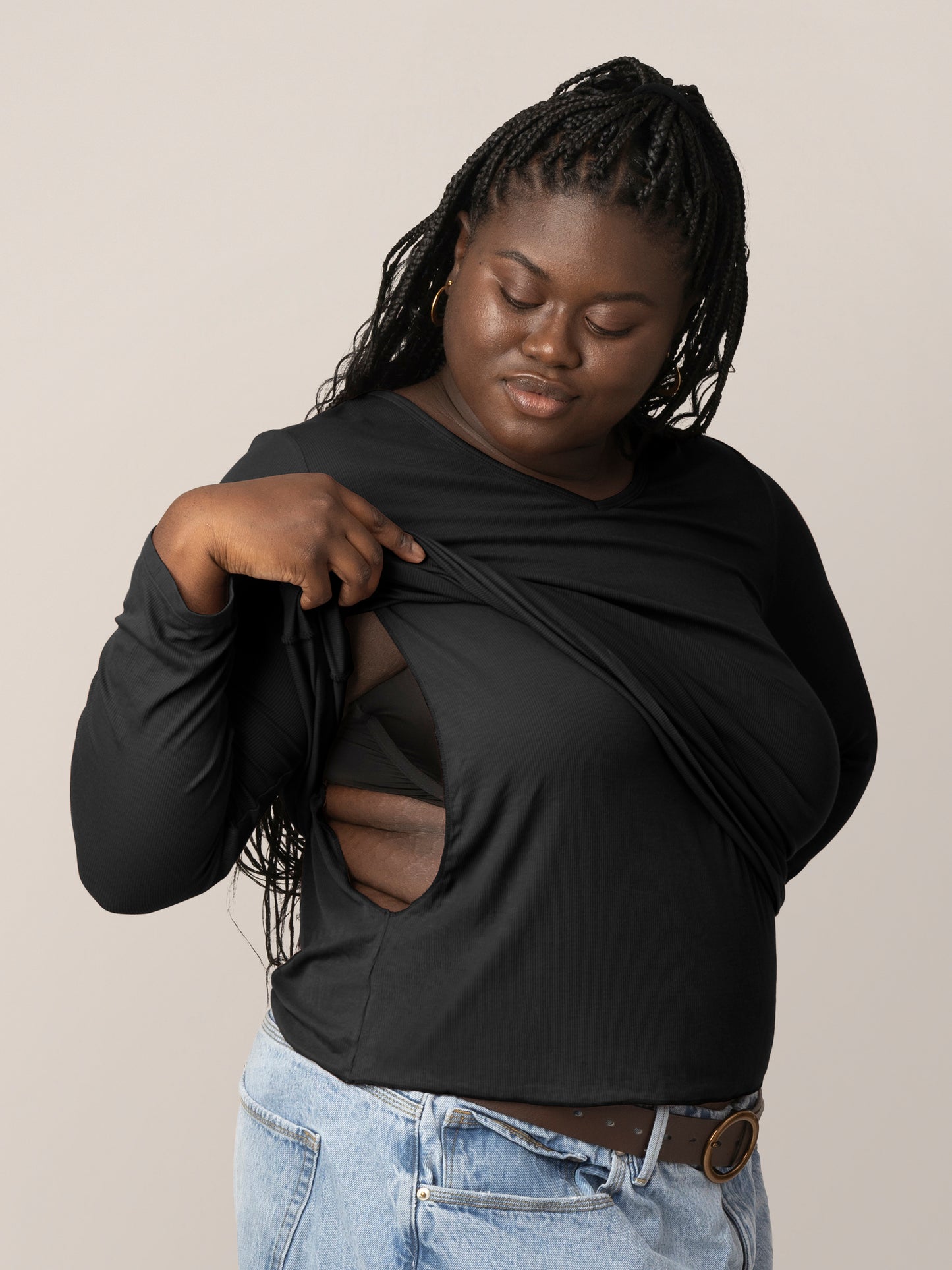 Side view of model wearing the Ribbed Bamboo Maternity & Nursing Long Sleeve T-shirt in Black, showing nursing access