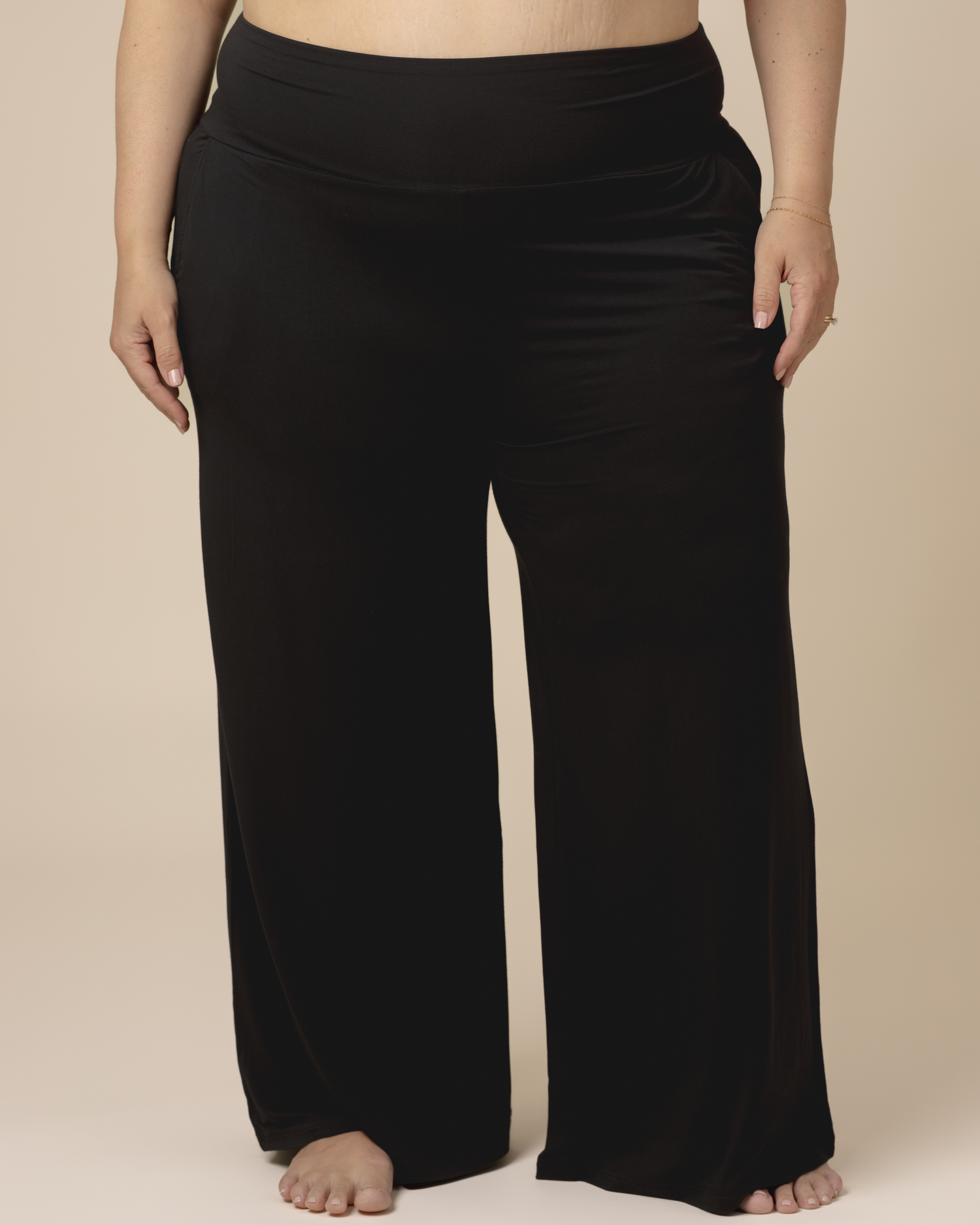 Cropped in front view of model wearing the Bamboo Wide Leg Maternity & Postpartum Lounge Pant in Black. @model_info:Gia is 5'8" and wearing a 3X.