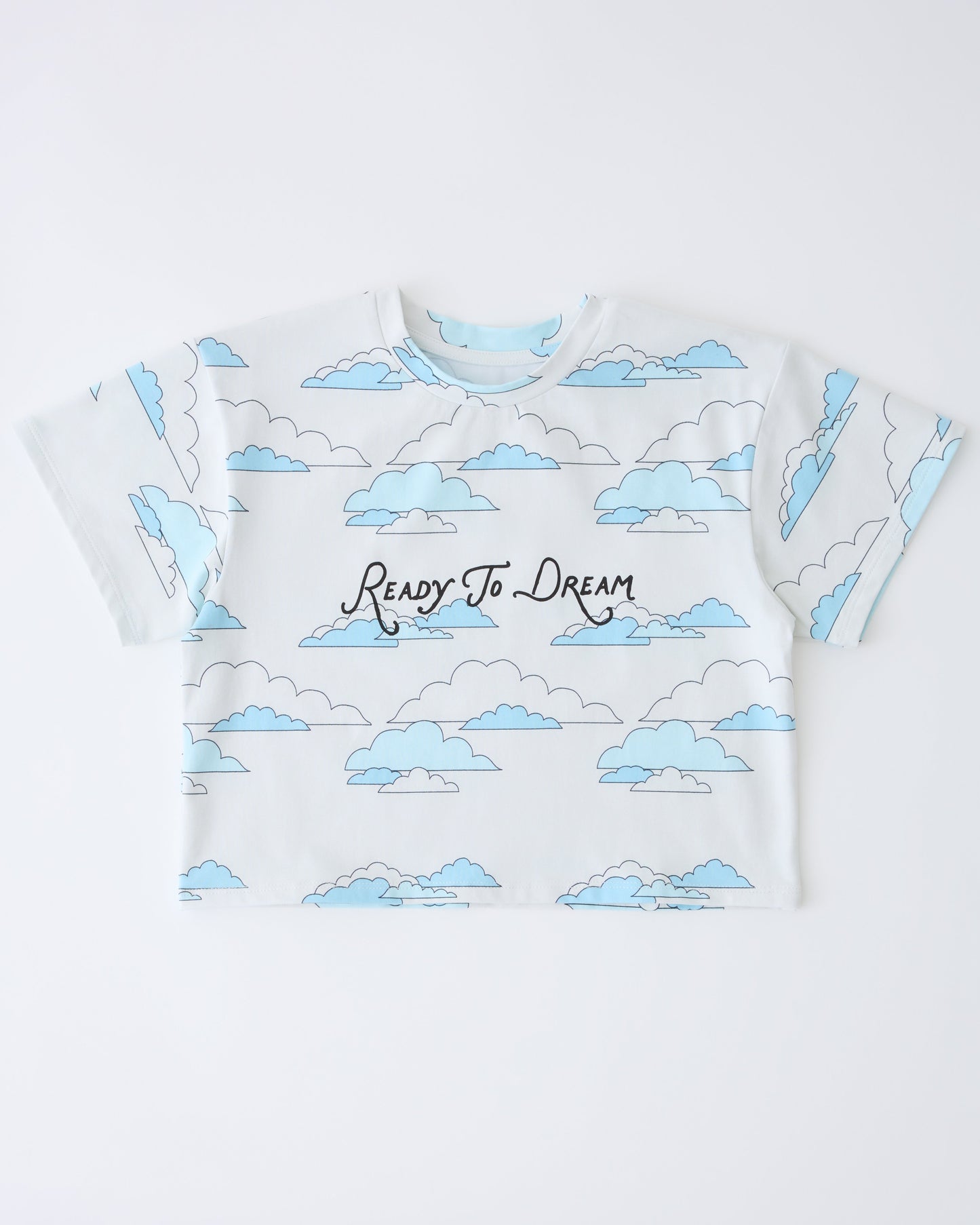 Graphic Tee in Ivory Clouds on a gray background.