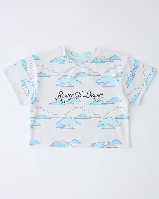 Graphic Tee in Ivory Clouds on a gray background.