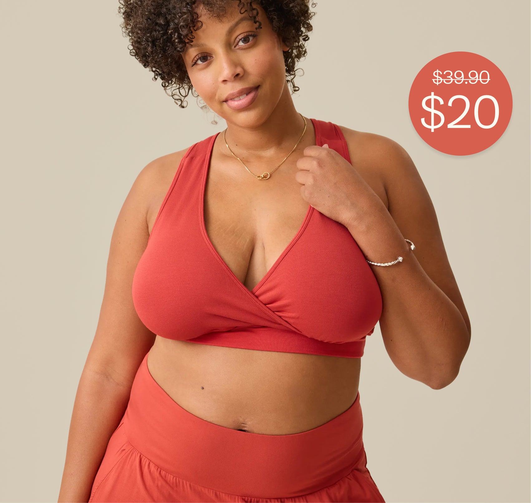 Red call out spot with white text: Crossed out $39.99. $20. Image of model is wearing French Terry Racerback Nursing & Sleep Bra in Spice and Bamboo Wide Leg Maternity & Postpartum Lounge Pant in Spice on a beige background. 