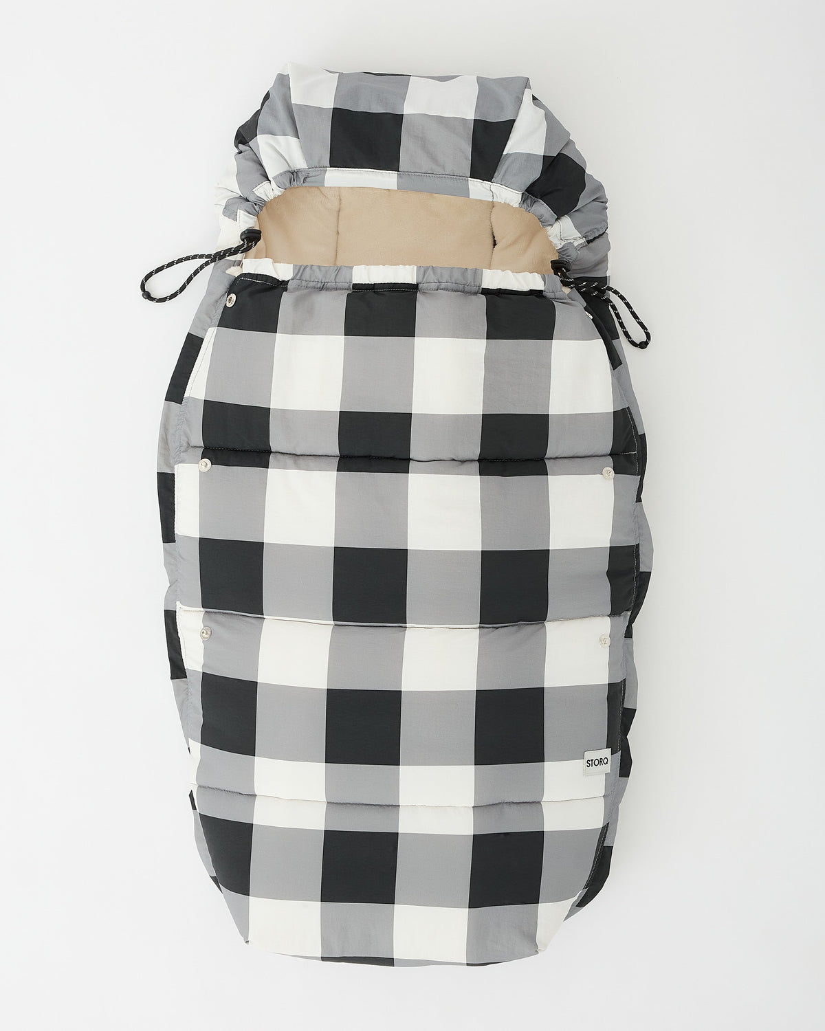 Cozy Stroller Footmuff in Buffalo Plaid in flat lay on an off white background.