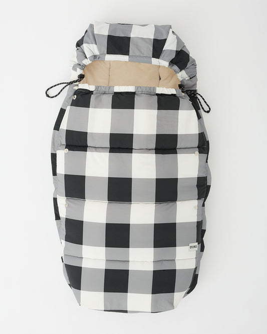 Cozy Stroller Footmuff in Buffalo Plaid in flat lay on an off white background.