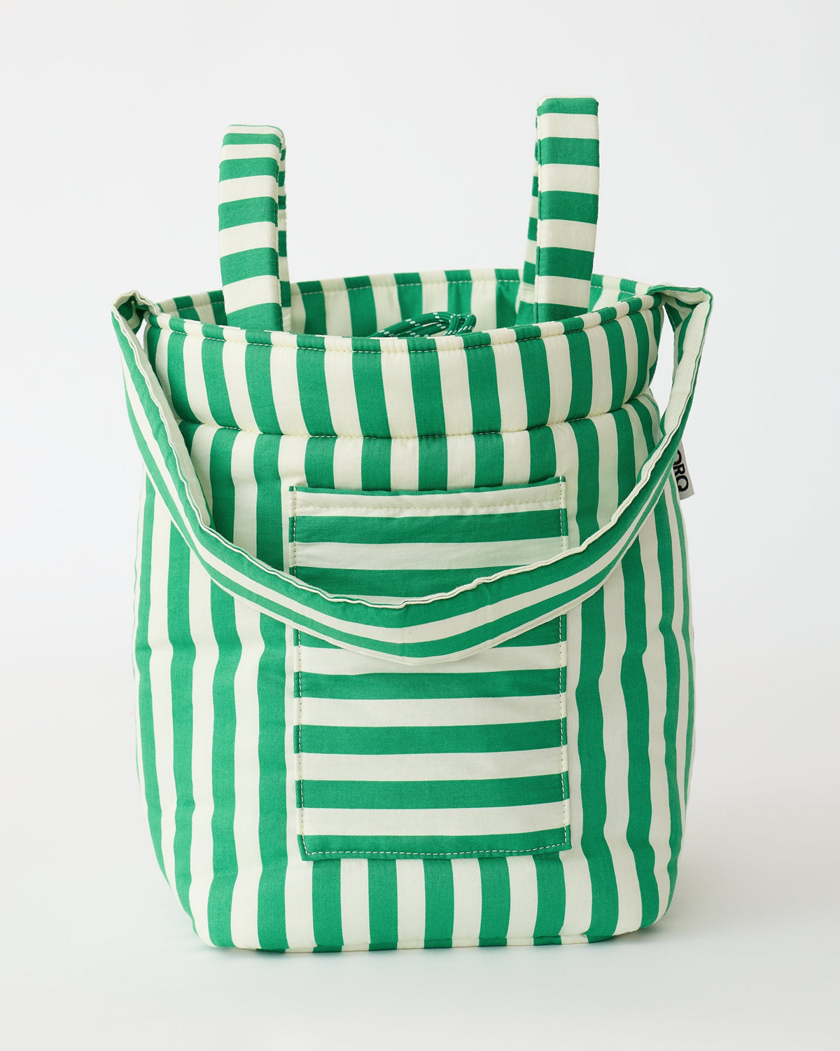 Stroller Party™ Bucket Bag in Green Stripe is sitting upright, on a beige background.