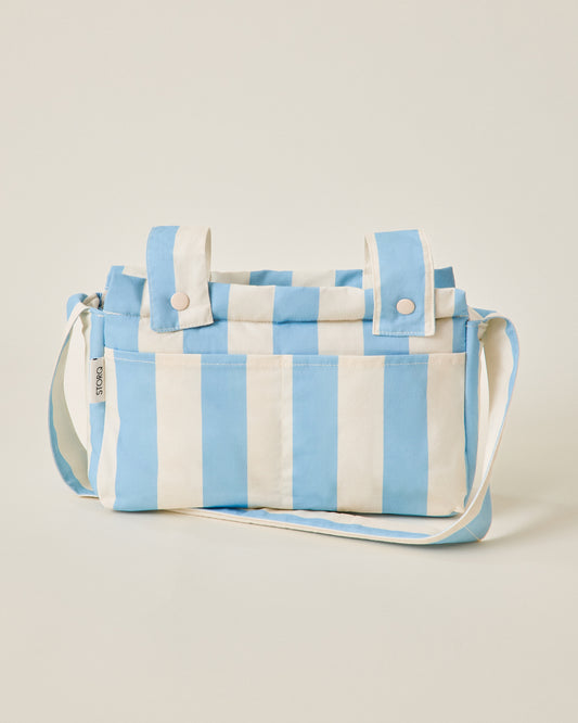 Stroller Party Caddy Bag in Blue Wide Stripe pattern on a beige background
