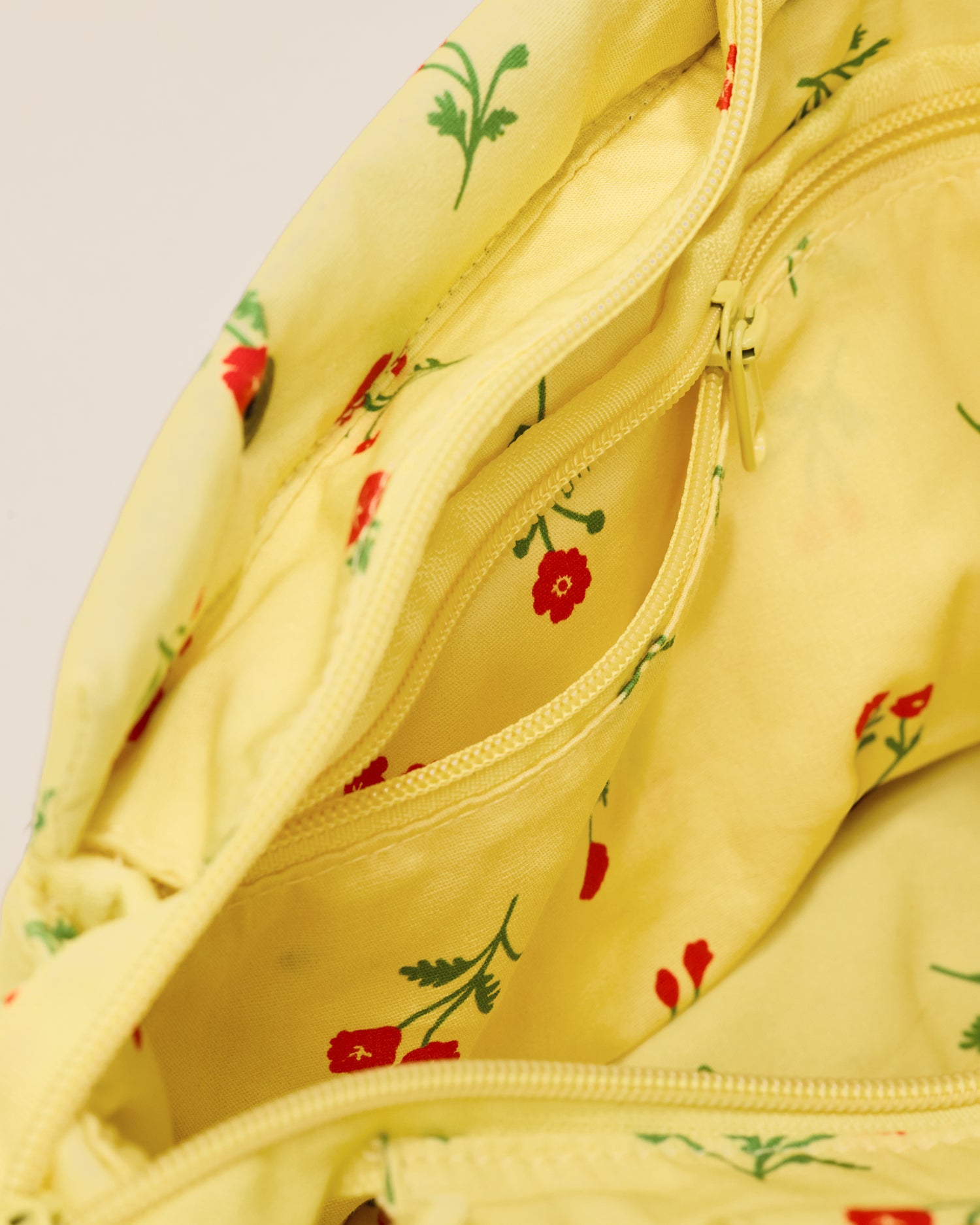 Close up of Stroller Party Caddy Bag in Sunshine Wildflower, showing the inside of the bag