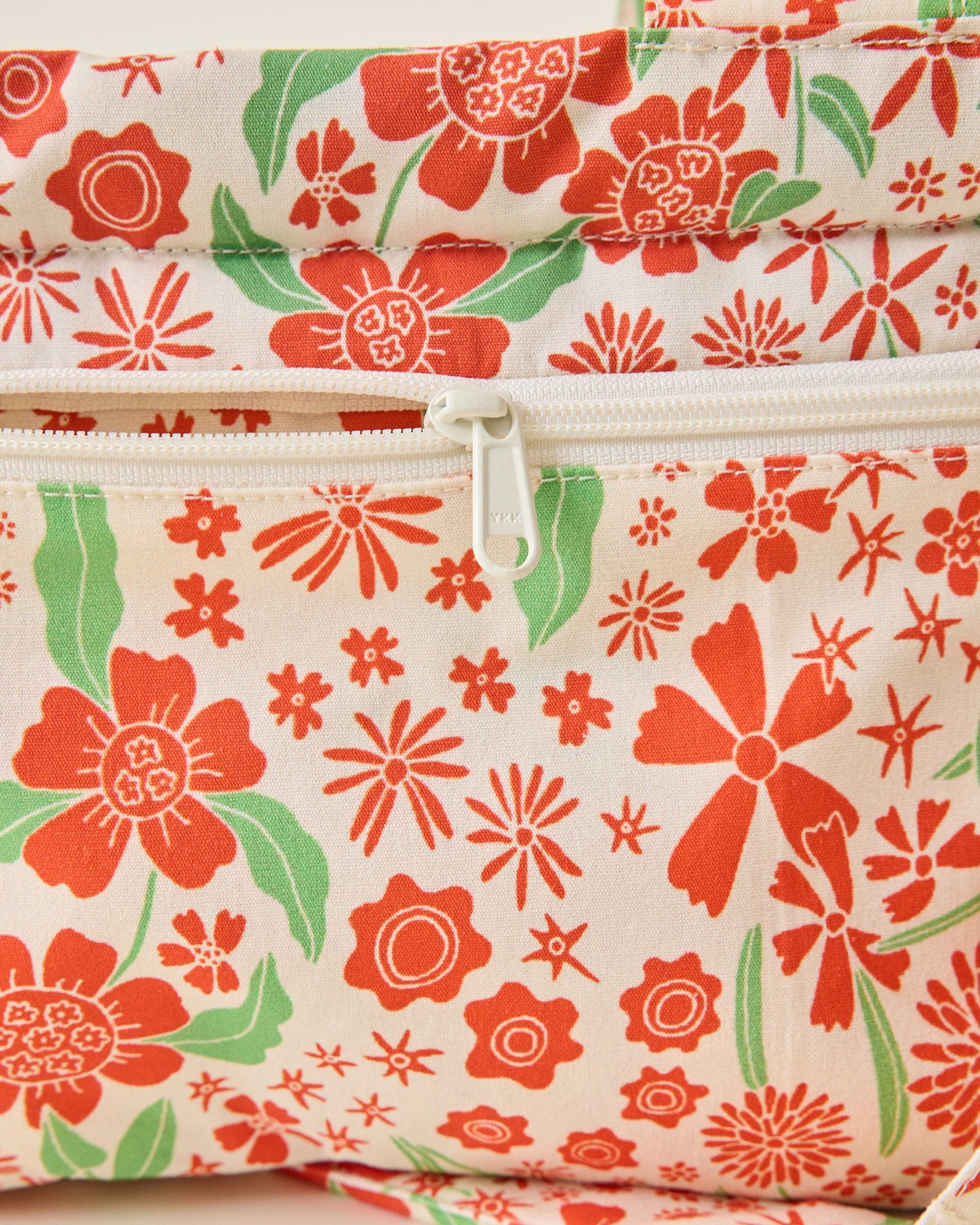 Close up of Stroller Party Caddy Bag in Superbloom on a beige background