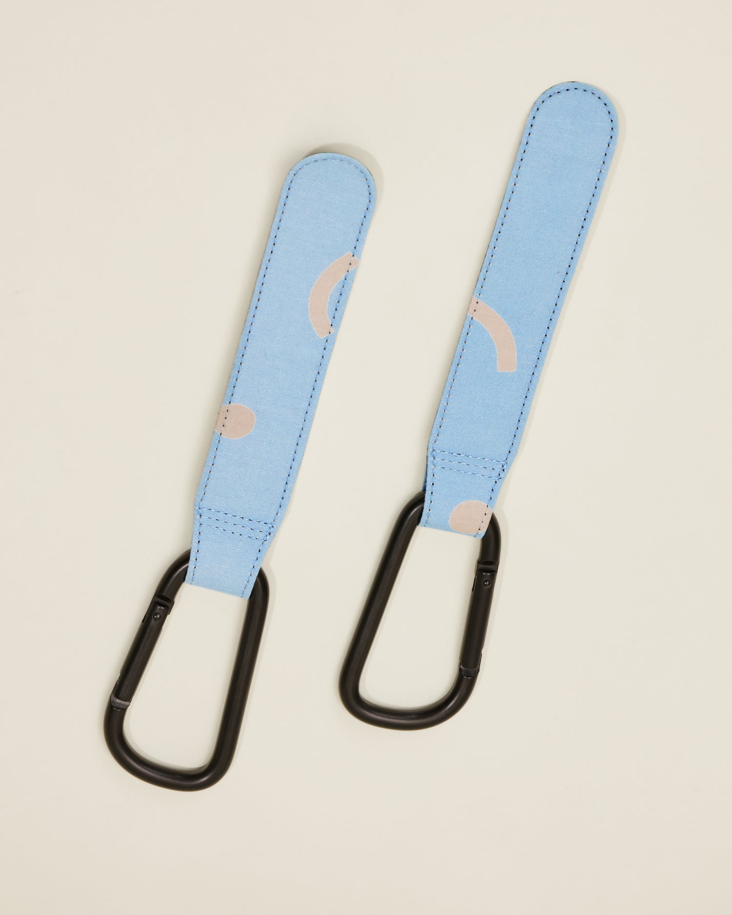 Stroller Party Clips in Sky Squiggles, on a neutral background