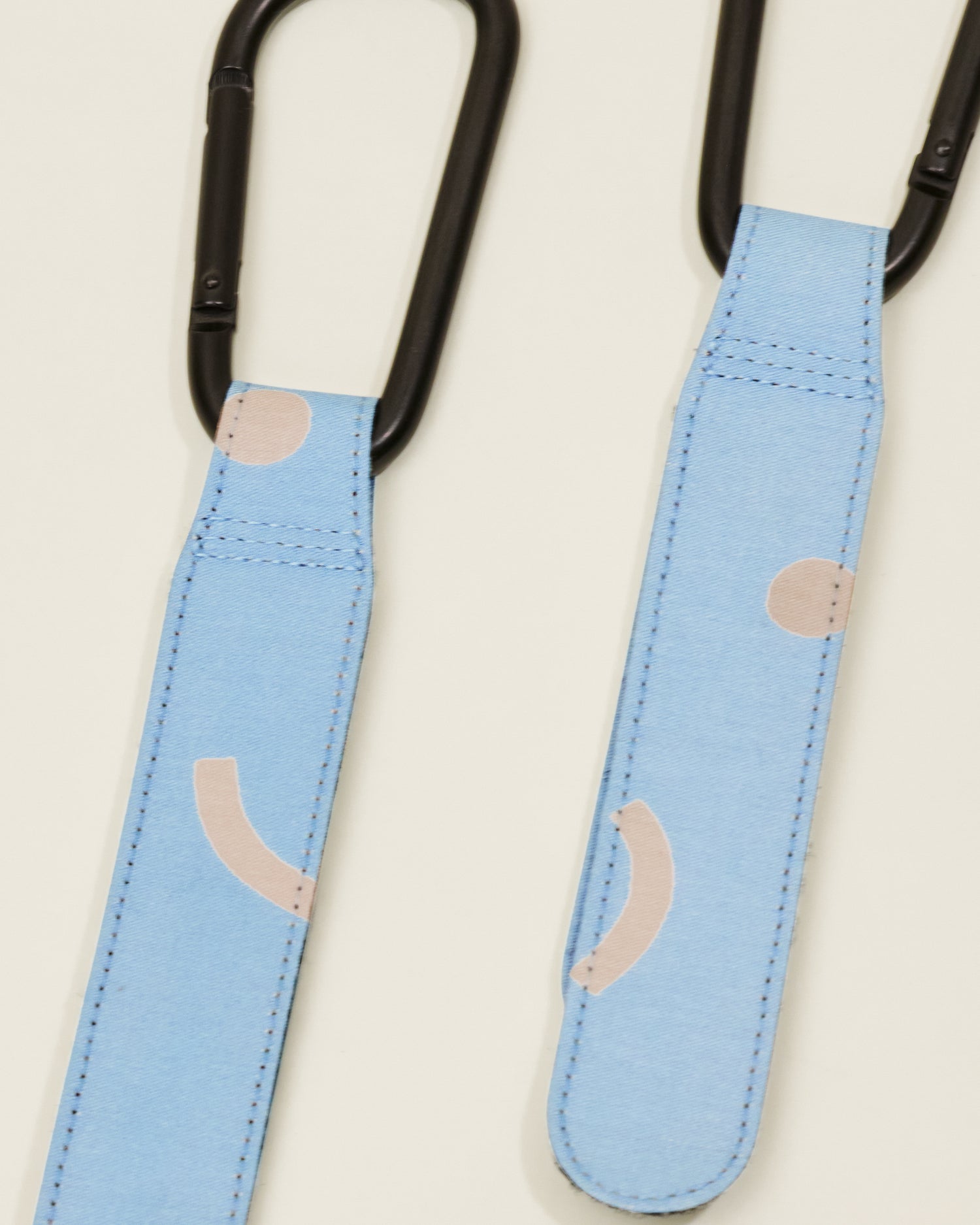 Close up of Stroller Party Clips in Sky Squiggles, on a neutral background