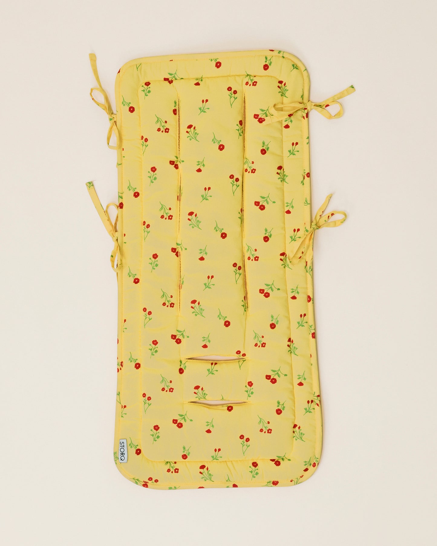 Stroller Party Seat Liner in Sunshine Wildflower on a neutral background