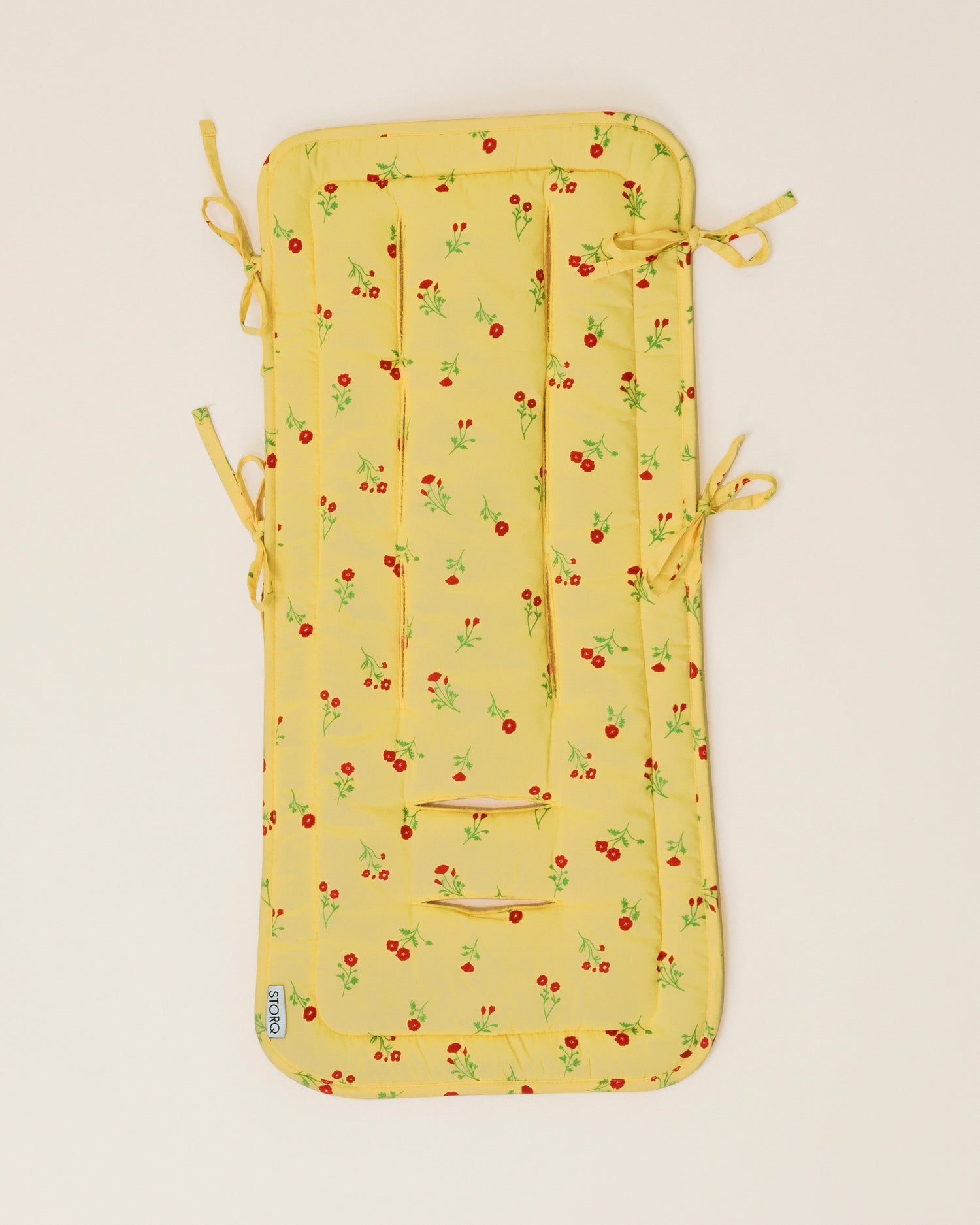 Stroller Party Seat Liner in Sunshine Wildflower on a neutral background