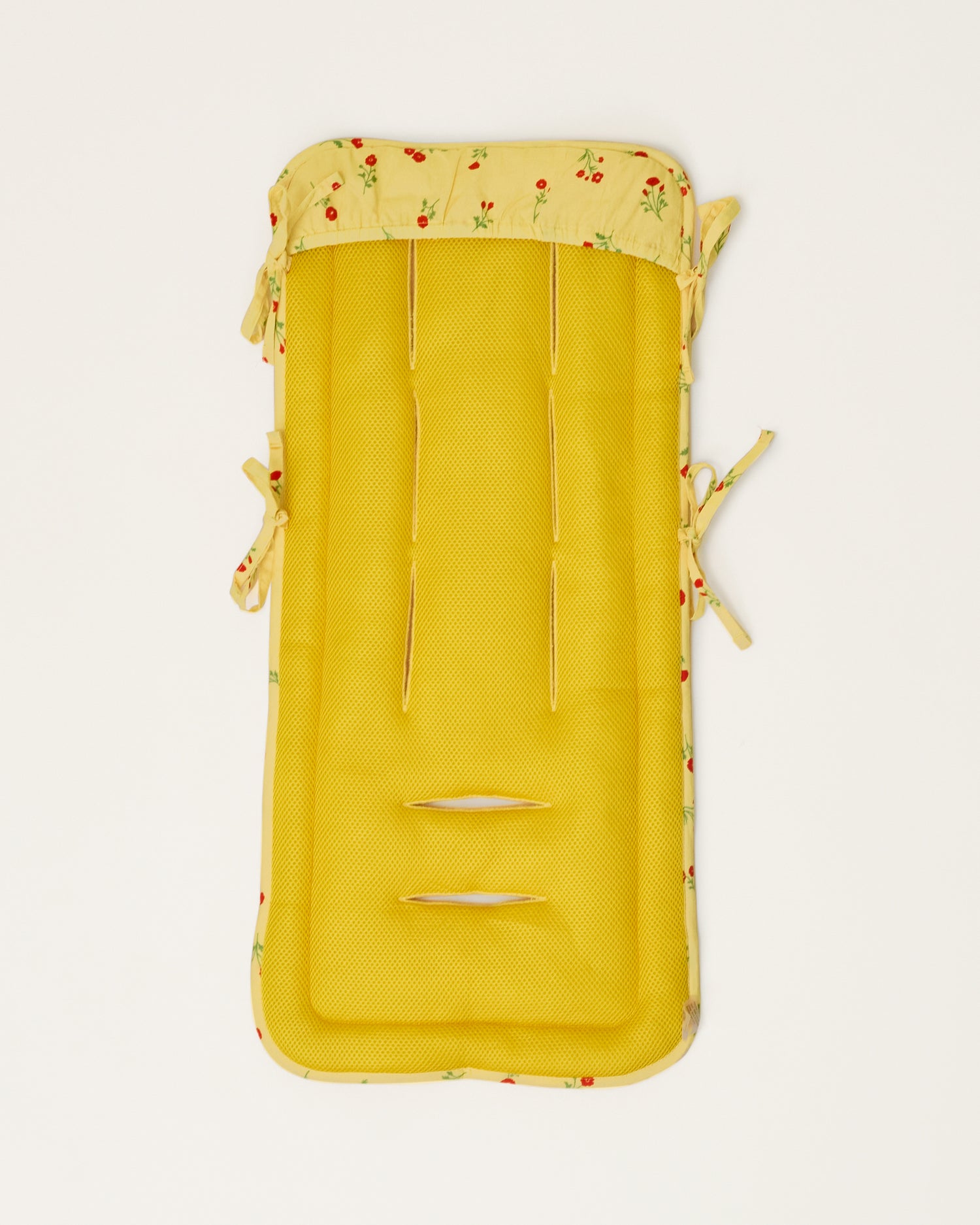 Stroller Party Seat Liner in Sunshine Wildflower on a neutral background, showing the back of the seat liner