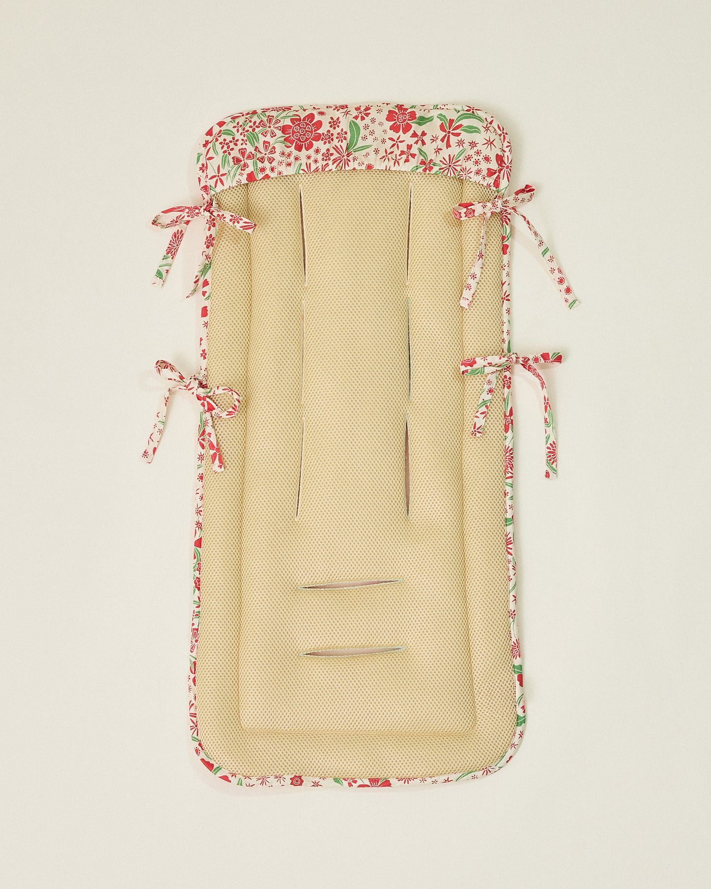 Stroller Party Seat Liner in Superbloom flipped over to display textured underside on a neutral background