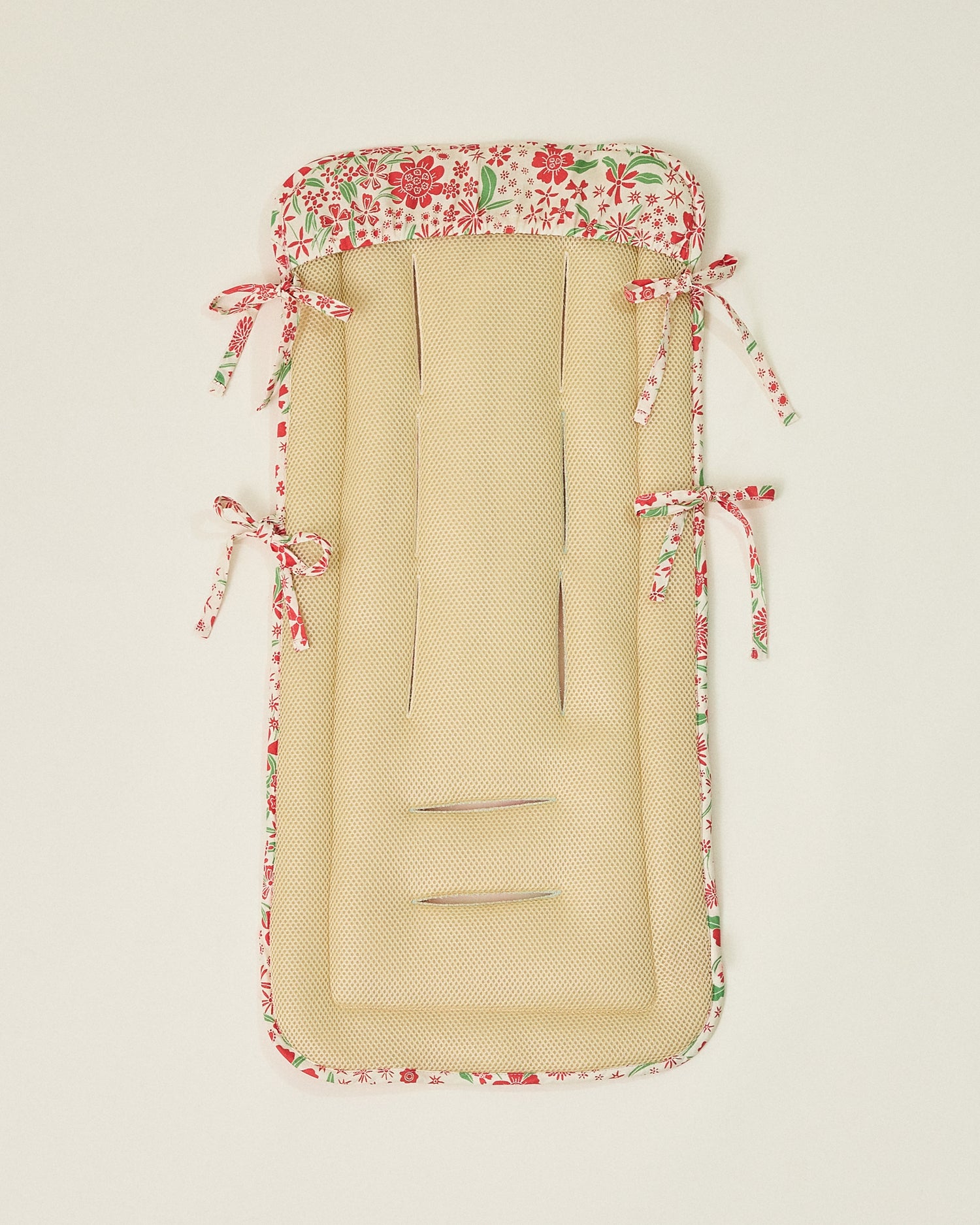 Stroller Party Seat Liner in Superbloom flipped over to display textured underside on a neutral background