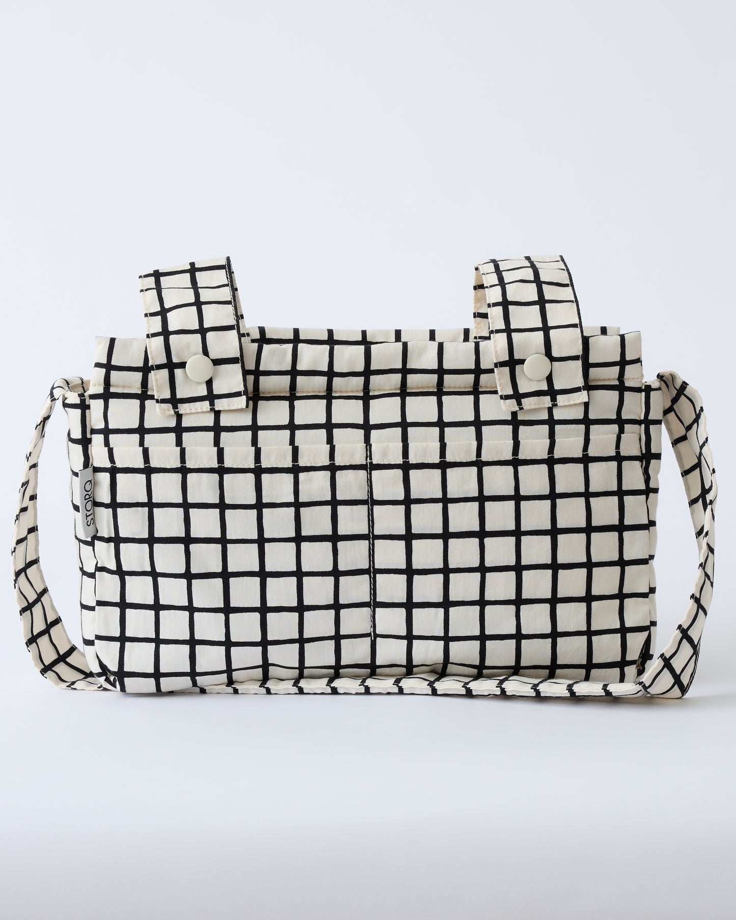 Stroller Party™ Caddy Bag in Black Grid, on a beige background.