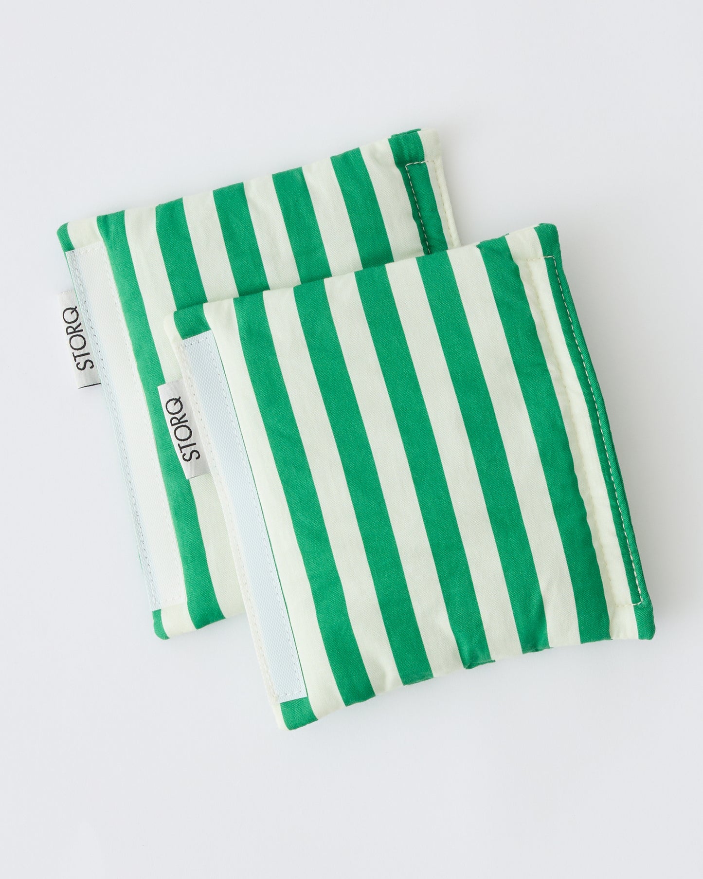 Unfolded Stroller Party™ Seat Liner & Strap Covers in Green Stripe on a beige background.