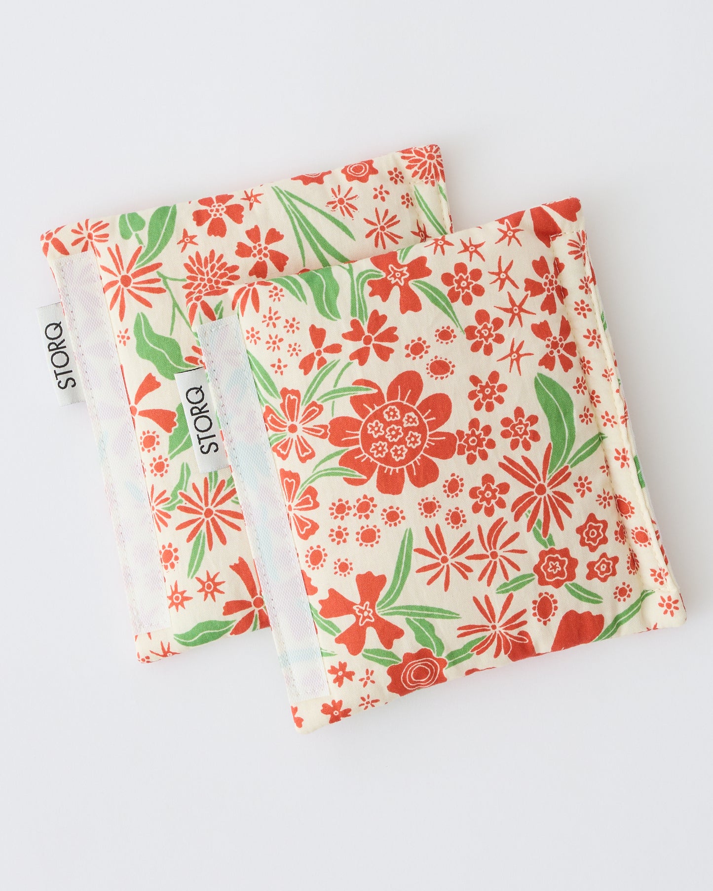 Unfolded Stroller Party™ Strap Covers in Superbloom on a beige background.