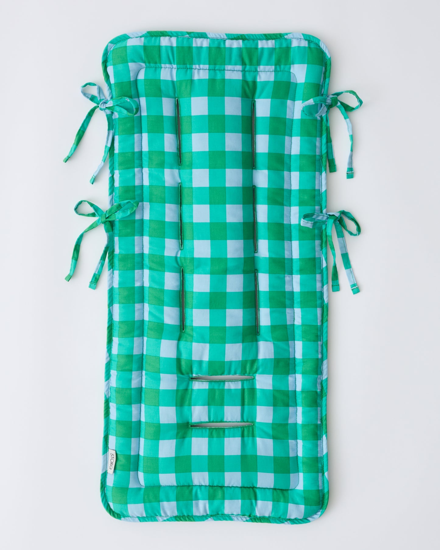 Front side of Stroller Party™ Seat Liner in Teal Gingham on a beige background.